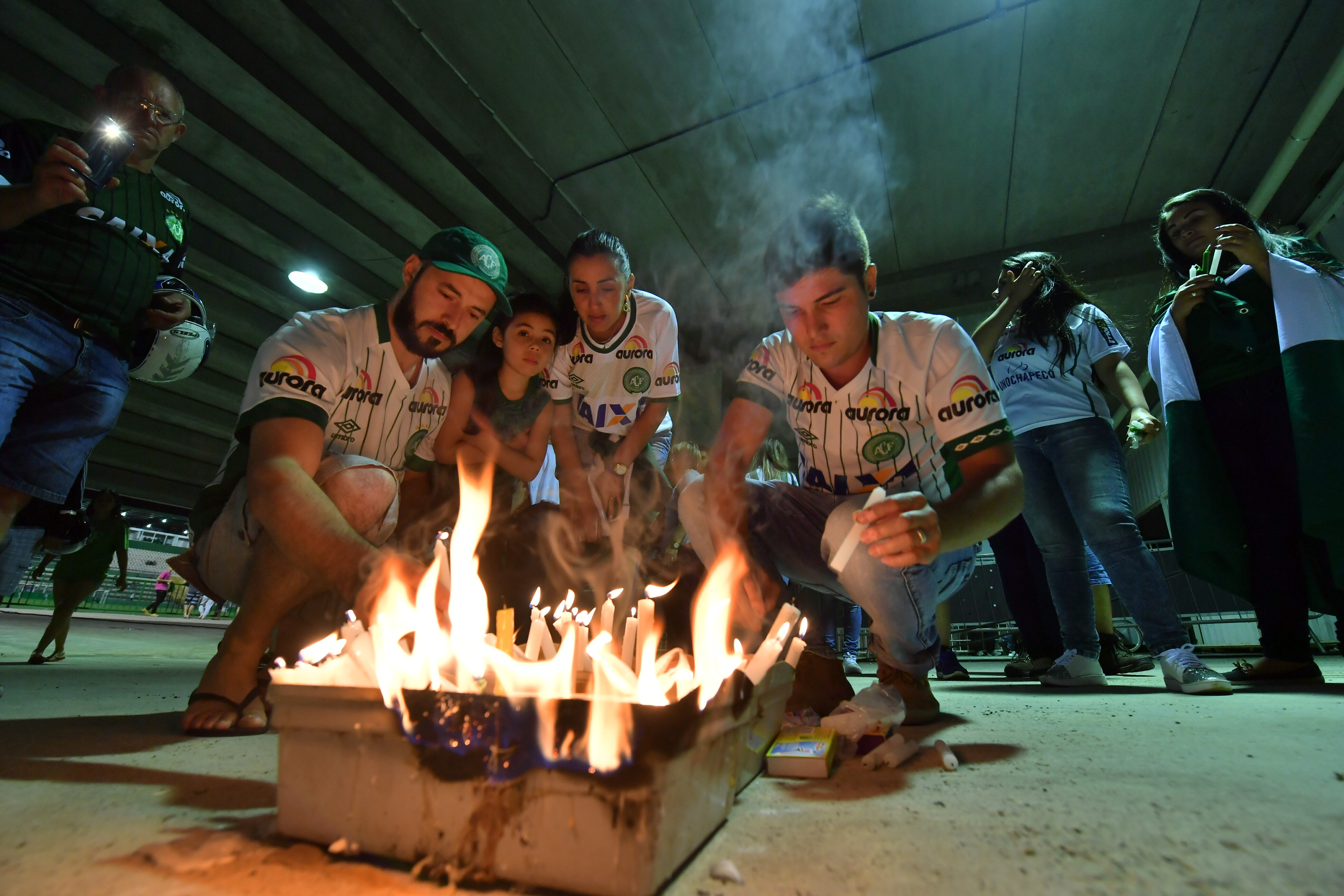 Fans light candles in tribute to the players of Brazilian team Chapecoense Real killed in a plane crash in the Colombian mountains, at their football stadium in Chapeco, Santa Catarina, Brazil on November 29, 2016. (NELSON ALMEIDA—AFP/Getty Images)