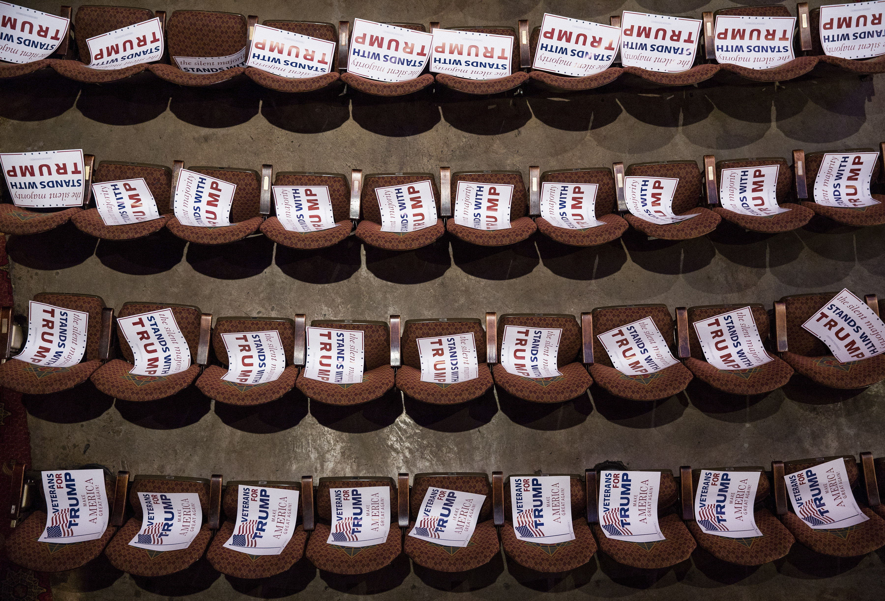 Campaign signs left on the seats before Donald Trump's campaign rally at the Fox Theatre in Atlanta, on June 15, 2016.