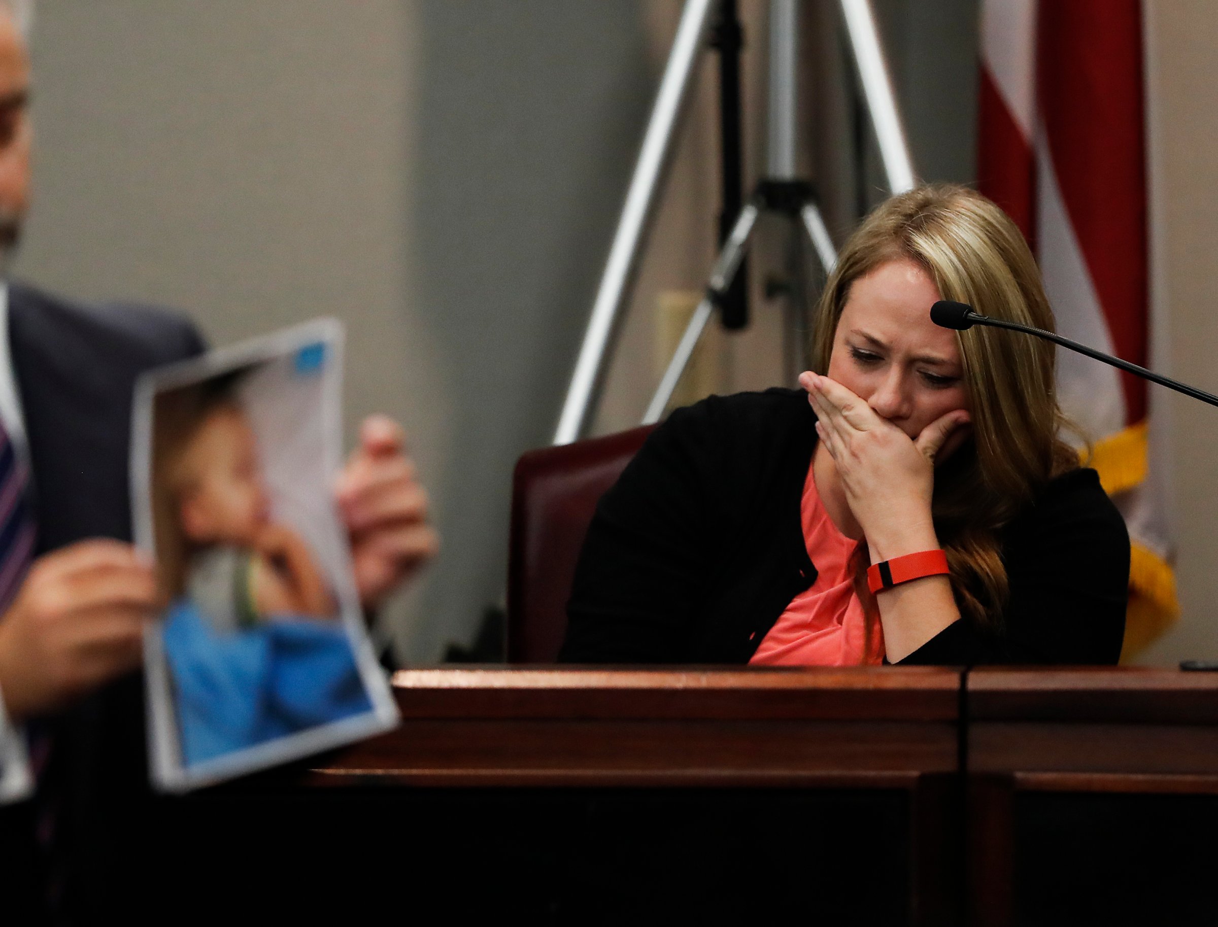 Leanna Taylor cries as an attorney shows photographs of her son Cooper to the jury during a murder trial for her ex-husband Justin Ross Harris, on Oct. 31, 2016, in Brunswick, Ga.
