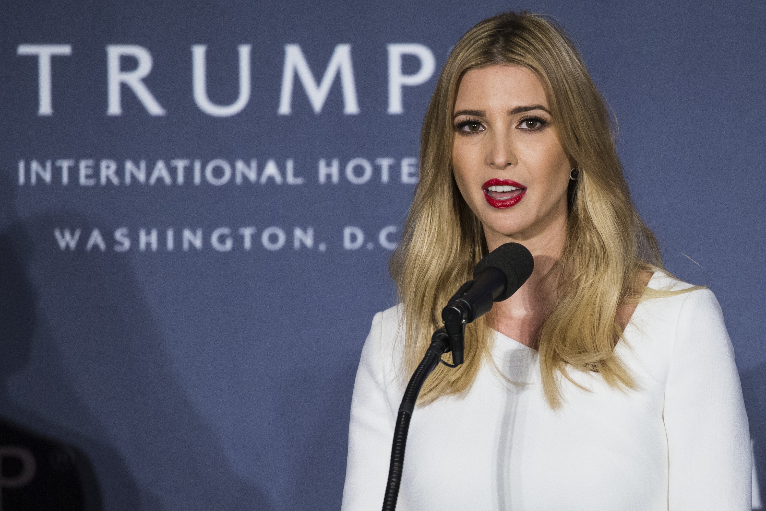 Ivanka Trump speaks as her father, Republican Presidential Candidate Donald Trump, stands with her on stage during the opening ceremony for the Trump International Hotel, Old Post Office, in Washington, USA on October 26, 2016. (Photo by Samuel Corum/Anadolu Agency/Getty Images) (Anadolu Agency—Getty Images)