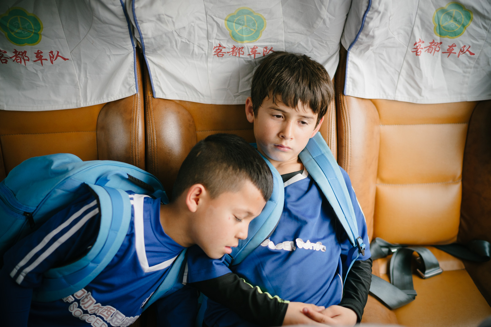 Kasim and Muhammad on their way to a football match in downtown Meizhou representing R&amp;F Soccer School. March 20, 2016.