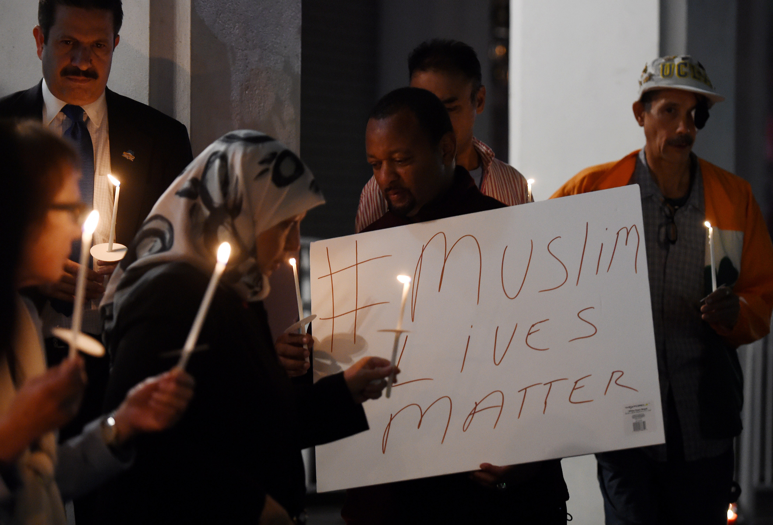 Muslims hold a candlelight vigil  at the Islamic Center of Southern California in Los Angeles on Feb. 12, 2015. (Mark Ralston—AFP/Getty Images)