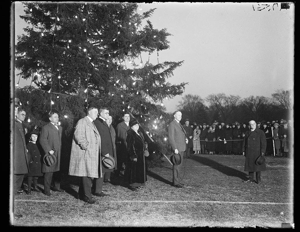 President Coolidge illuminating the community Christmas tree, south of the White House. (Library of Congress)