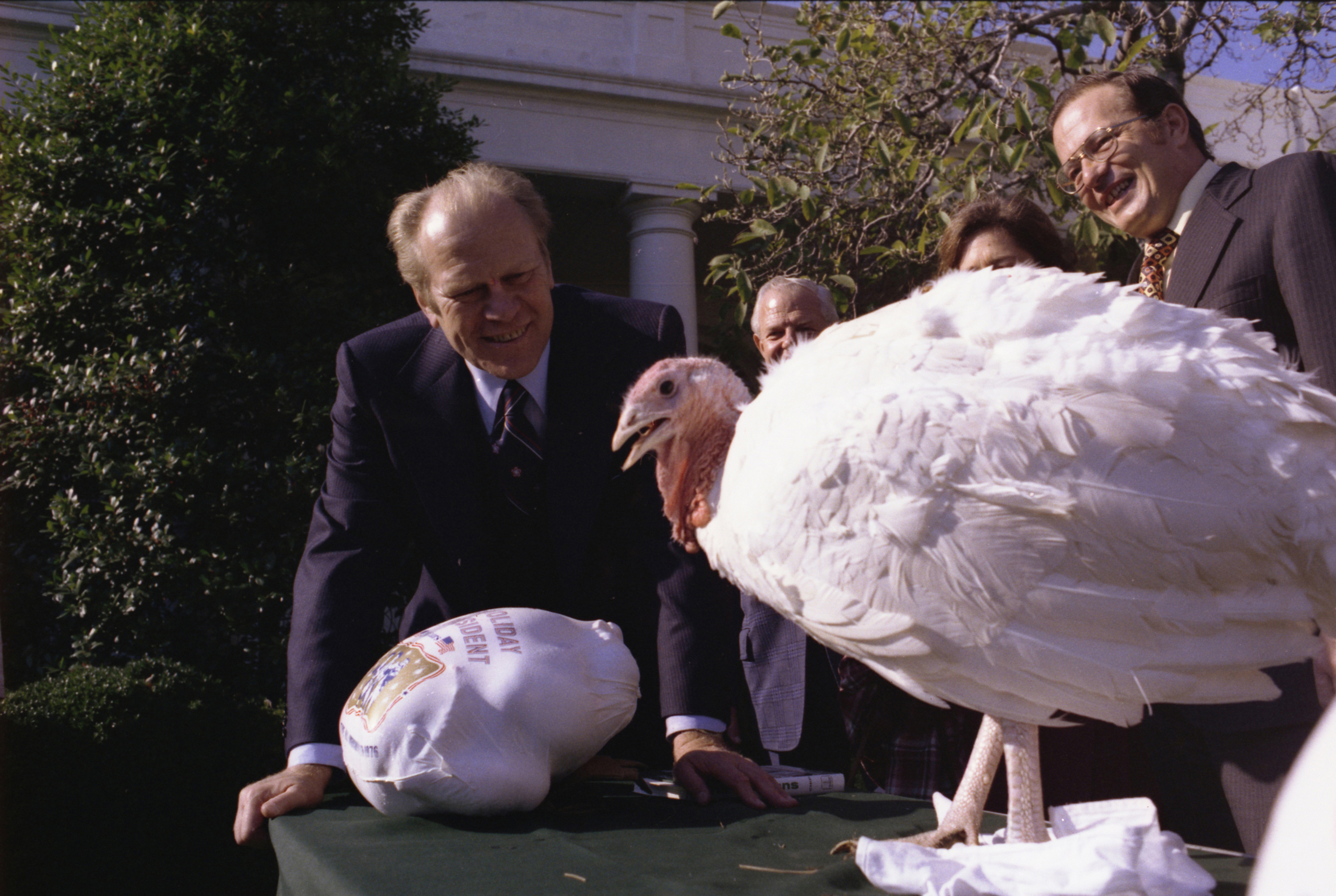 President Gerald R. Ford is presented with a Thanksgiving turkey by the National Turkey Federation at the White House, on Nov. 20, 1975.