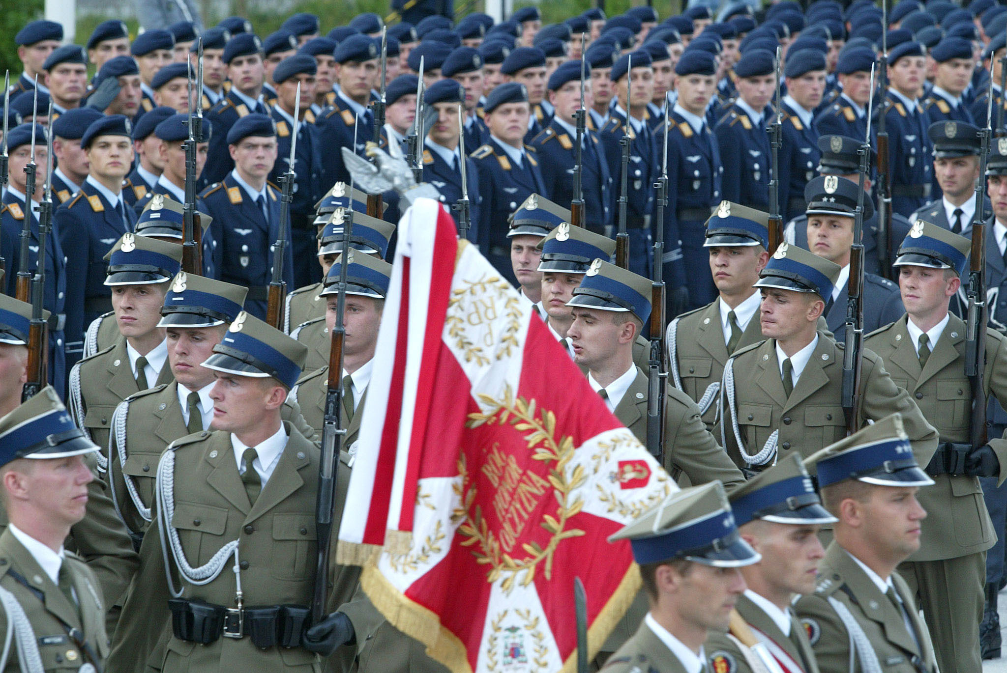 THE POLISH GUARD OF HONOUR MARCHES IN FRONT OF GERMAN SOLDIERS DURINGTHE CEREMONY IN BERLIN.