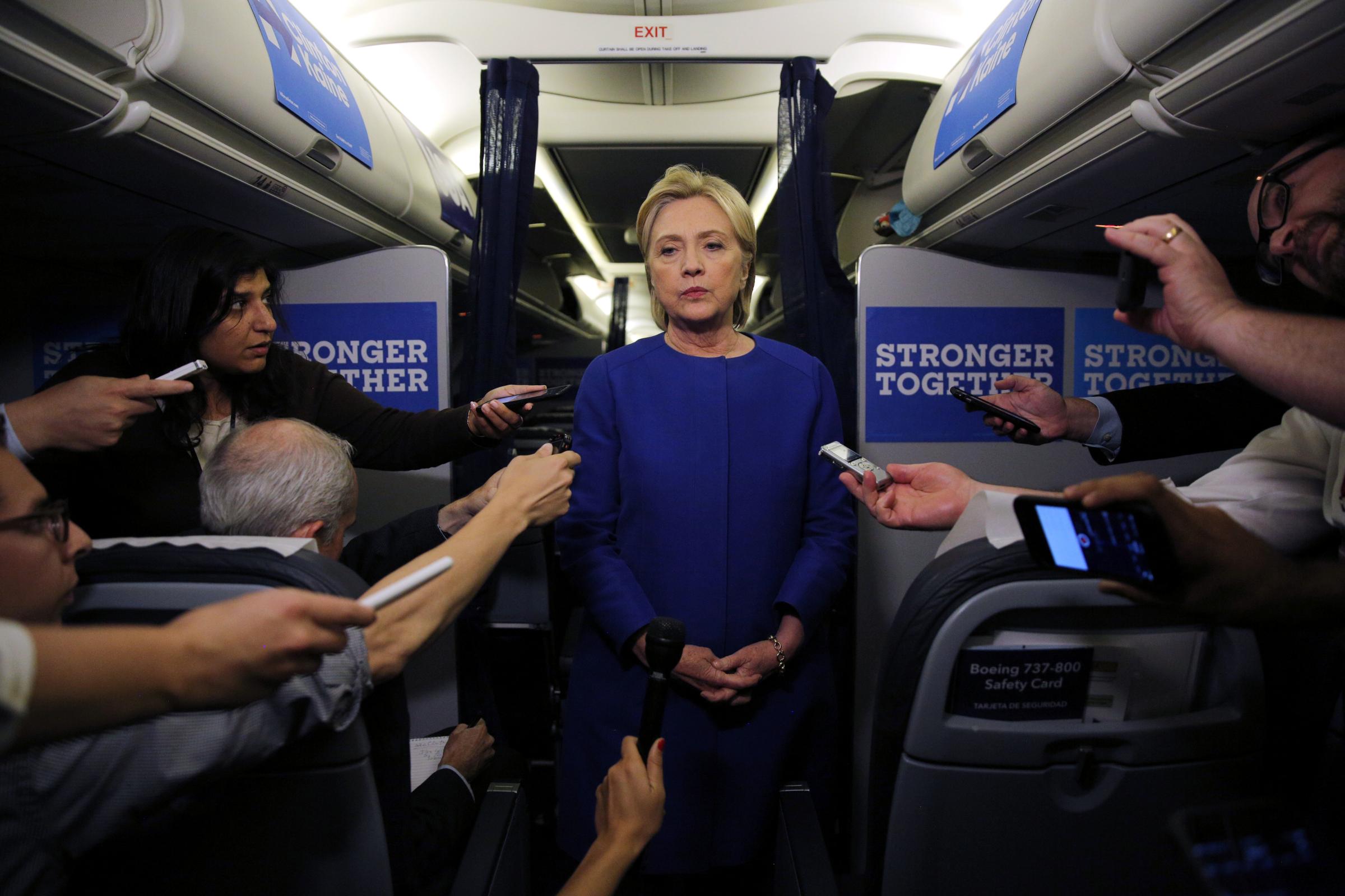 Democratic nominee Hillary Clinton talks to reporters about the explosion in Chelsea neighborhood of Manhattan, New York, as she arrives at the Westchester County airport in White Plains