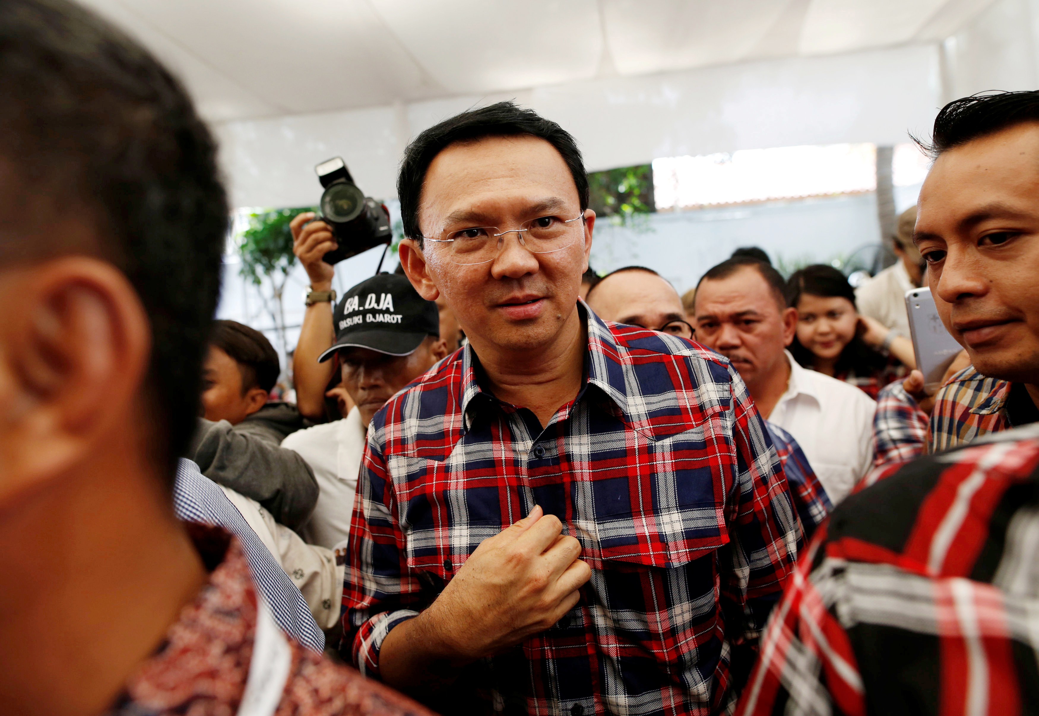 Jakarta Governor Basuki Tjahaja Purnama, nicknamed "Ahok", leaves the stage after meeting with supporters while campaigning for the upcoming election for governor in Jakarta