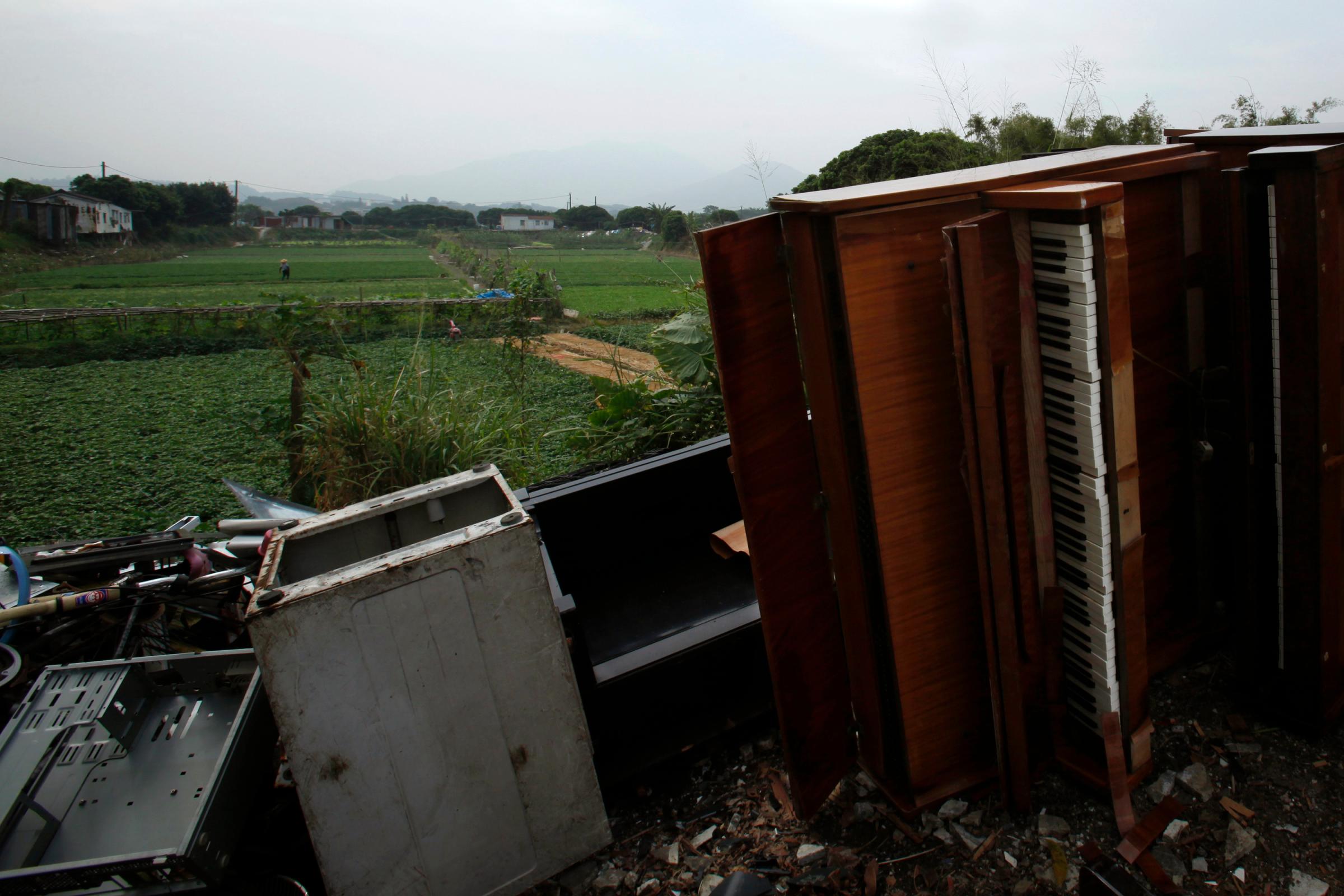 Unwanted pieces of furniture are dumped near farms in Hong Kong