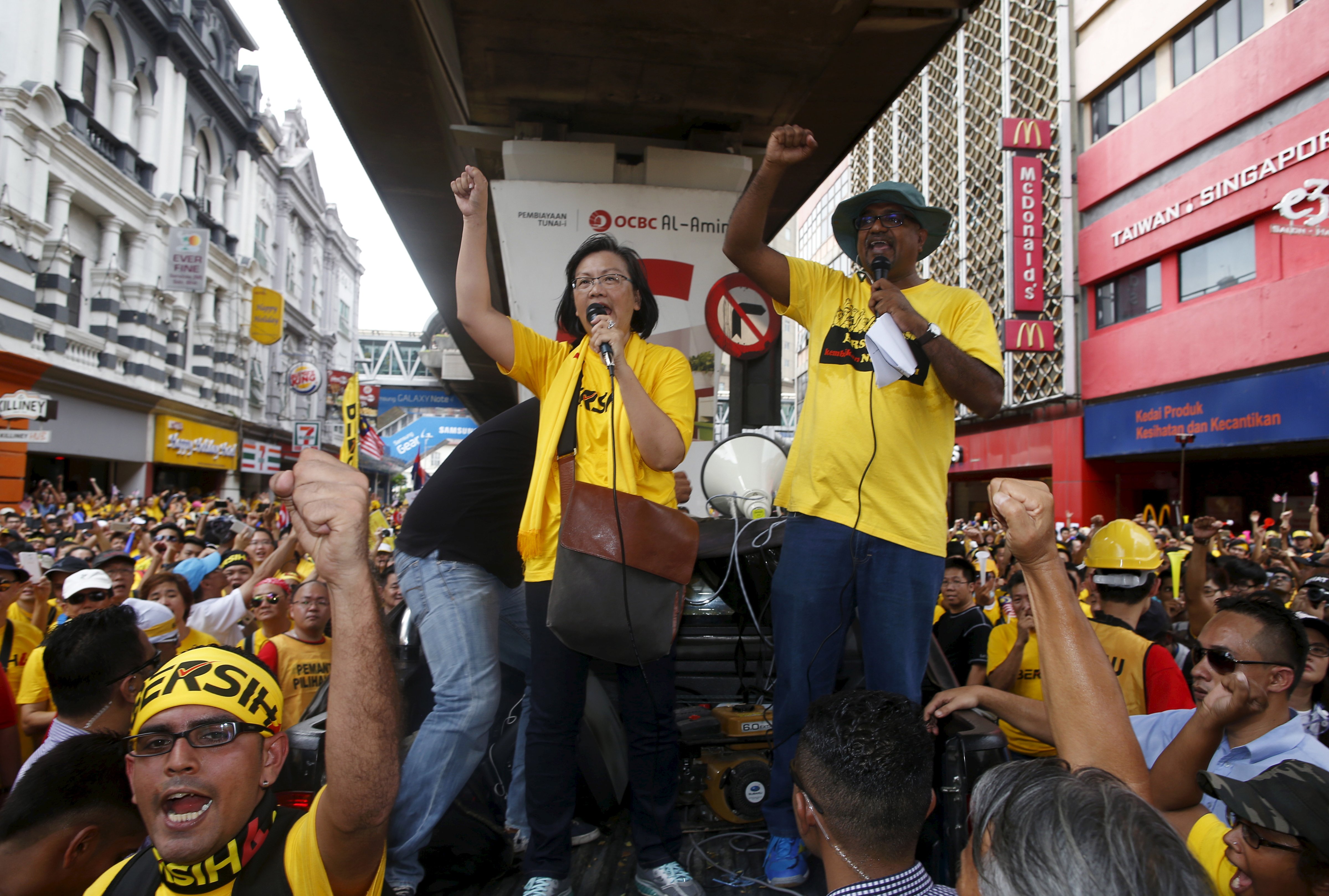 Malaysian pro-democracy group Bersih  chairwoman Maria Chin Abdullah, center, rallies supporters as they prepare to march towards Dataran Merdeka in Kuala Lumpur on Aug. 29, 2015 (Edgar Su—Reuters)