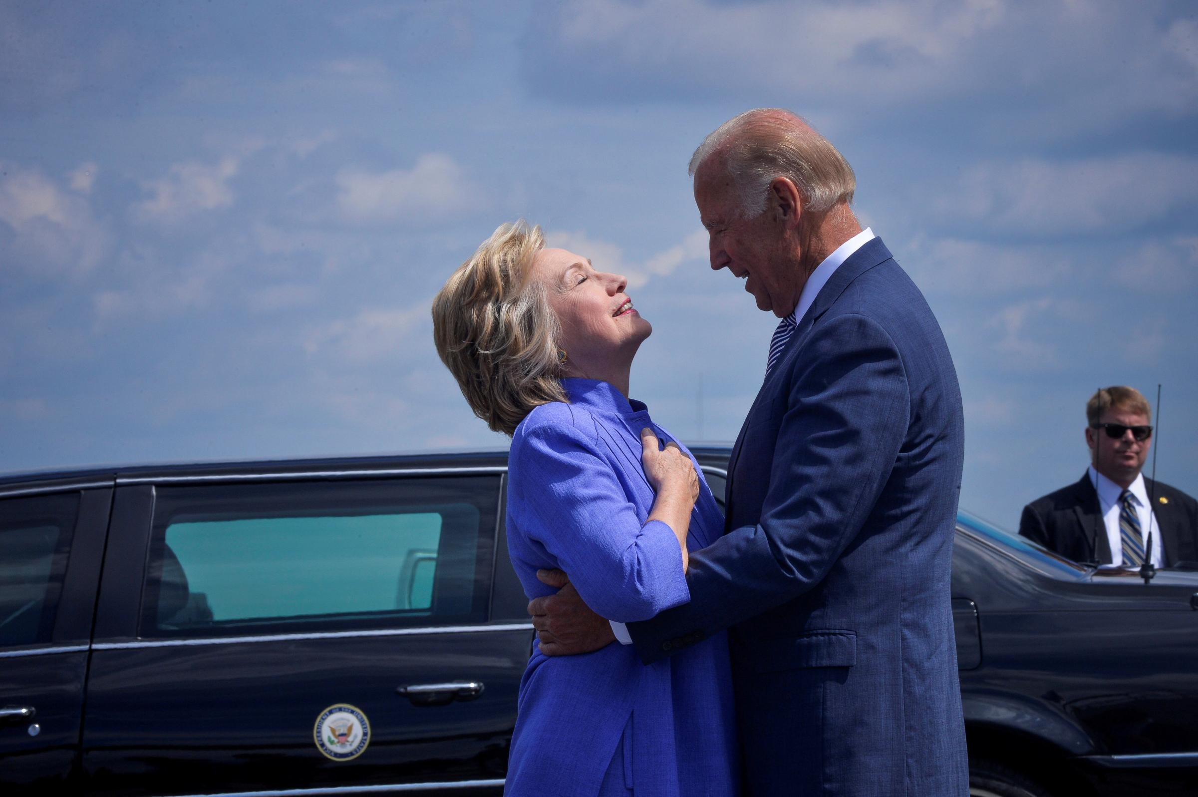 Democratic presidential nominee Hillary Clinton welcomes Vice President Joe Biden as he disembarks from Air Force Two for a joint campaign event in Scranton, Pennsylvania