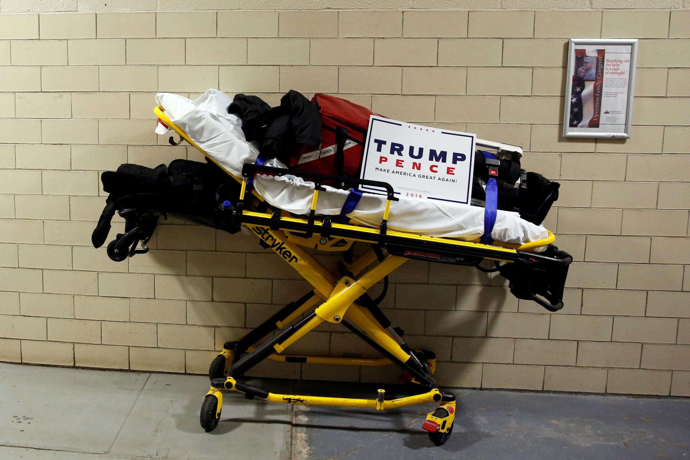 A paramedic's stretcher sits backstage with a Trump campaign sign on it as Trump holds a rally in Johnstown, Pennsylvania