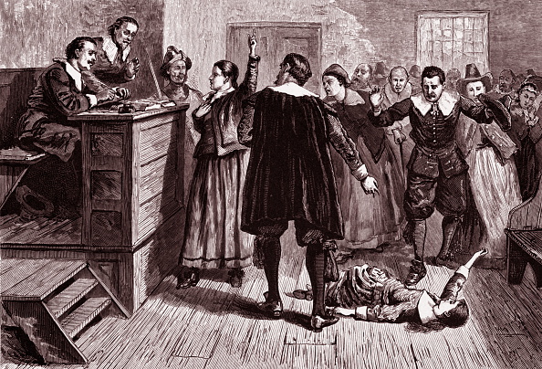 Engraving depicts witchcraft trial.