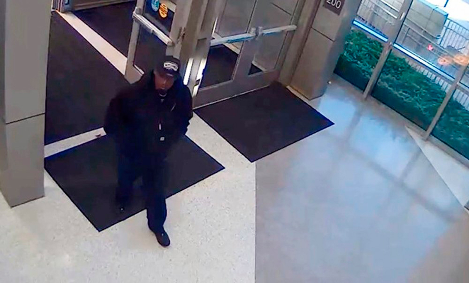 A man identified by the San Antonio Police Department as a suspect in the shooting death of police detective Benjamin Marconi, 50, is seen entering the police headquarters building in San Antonio, Texas, November 20, 2016, in a frame grab from video released by the police. San Antonio Police Department/Handout via REUTERS FOR EDITORIAL USE ONLY. NOT FOR SALE FOR MARKETING OR ADVERTISING CAMPAIGNS