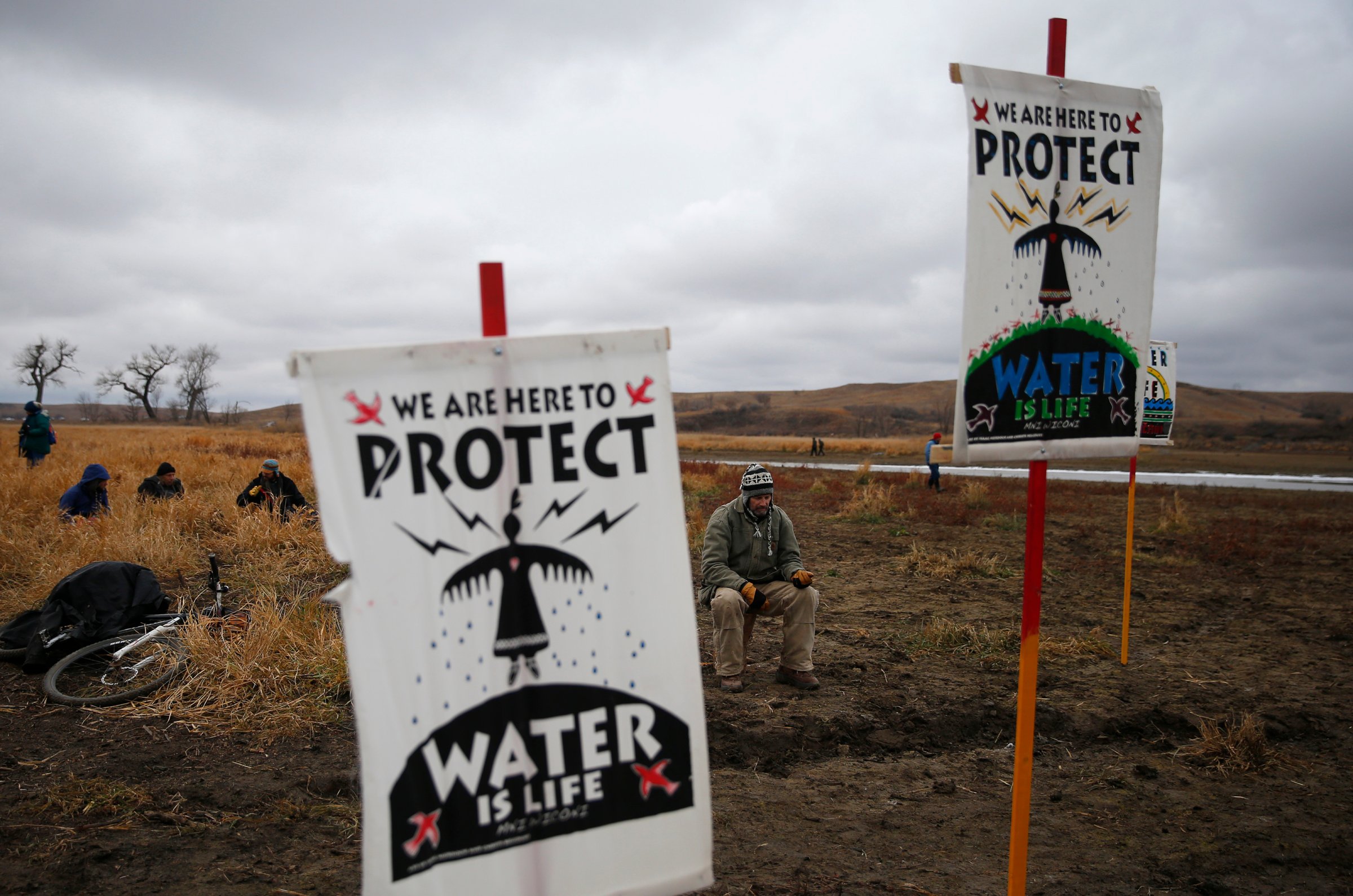 Water protectors protest as police line the hill at Standing Rock on Nov. 24, 2016, during an ongoing dispute over the building of the Dakota Access Pipeline.