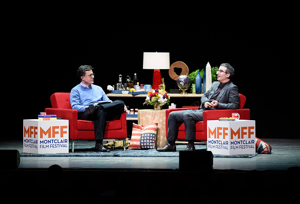 Stephen Colbert(L) and John Oliver (R) onstage at the Post-Election Evening to Benefit Montclair Film Festival at NJ Performing Arts Center on November 19, 2016 in Newark, New Jersey. (Dave Kotinsky/Getty Images for Montclair Film Festival)