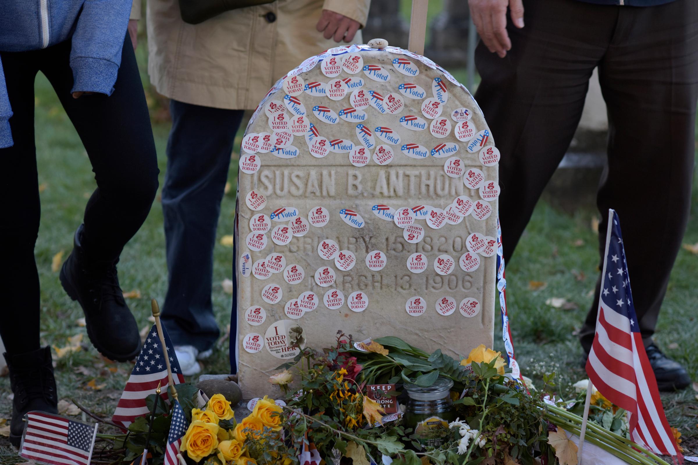 People visit the grave of women's suffrage leader Susan B. Anthony on U.S. election day at Mount Hope Cemetery in Rochester, New York
