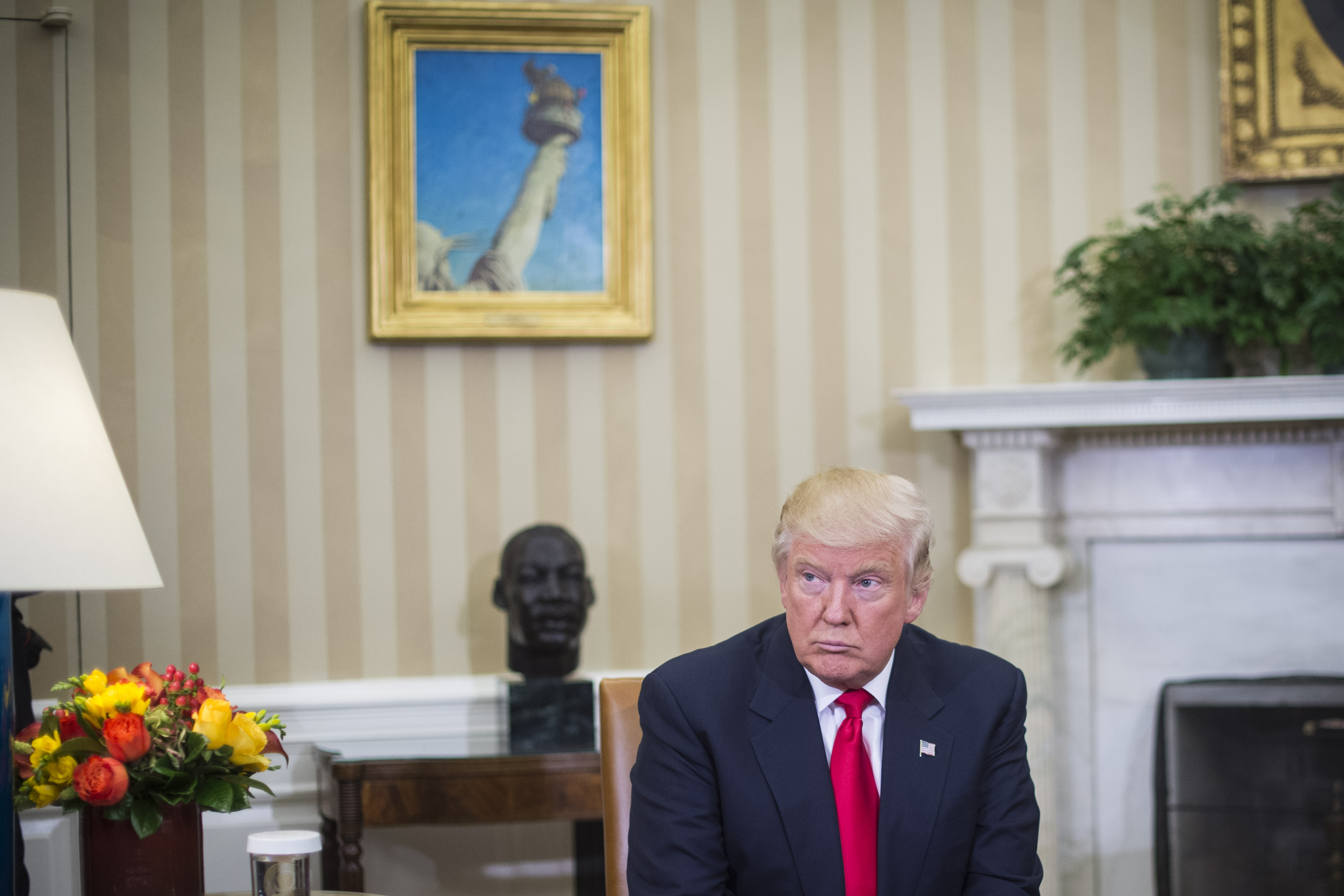 President-elect Donald Trump listens as President Barack Obama talks to the media in the Oval Office of the White House in Washington on Nov. 10, 2016.