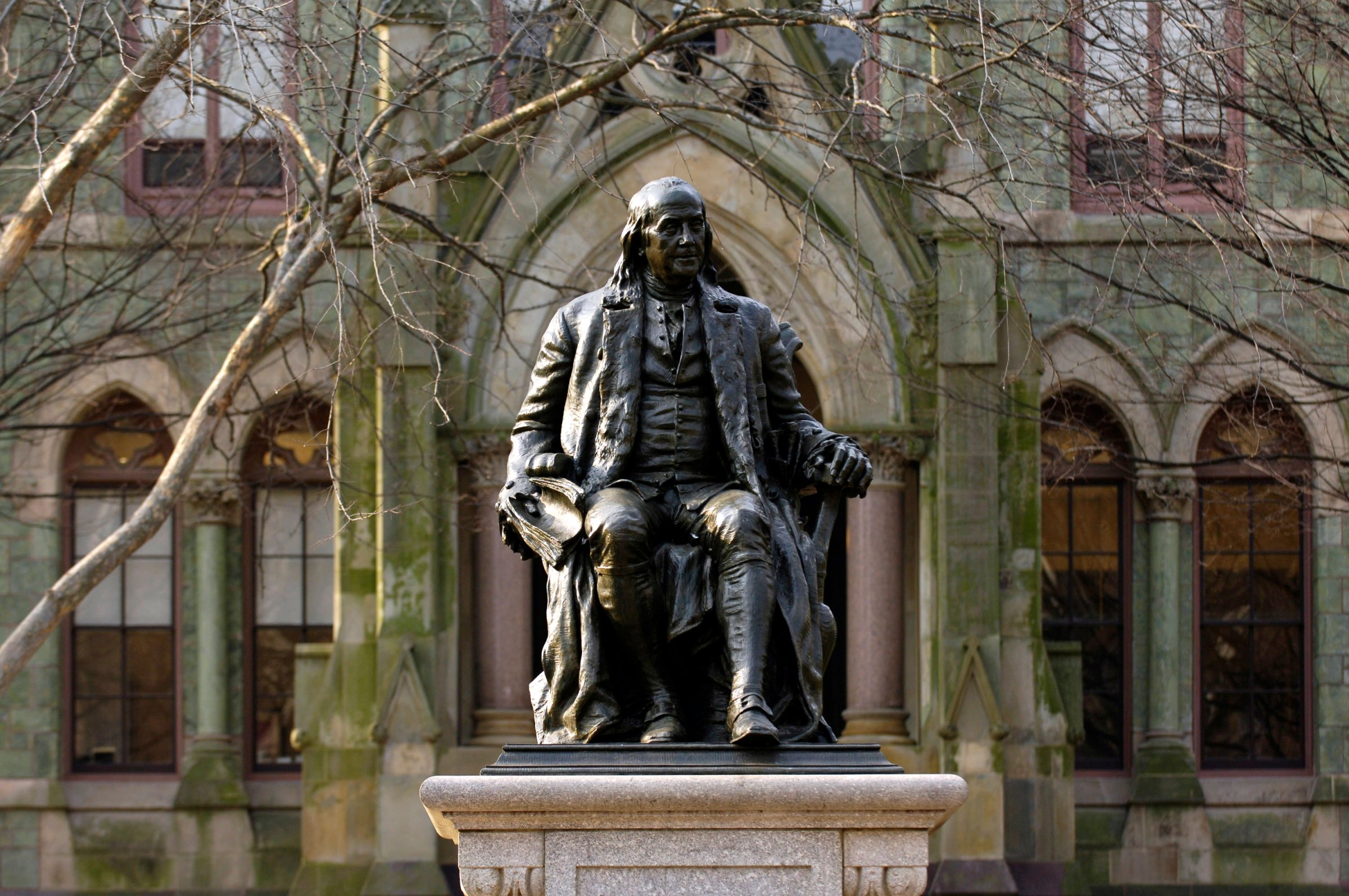 A statue of Benjamin Franklin, founder of the University of