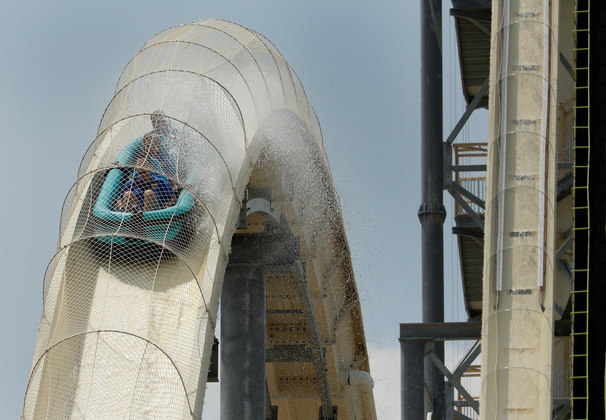 Riders are propelled by jets of water as the go over a hump while riding the world's tallest water slide called "Verruckt" at Schlitterbahn Waterpark, on July 9, 2014, in Kansas City, Kan.
