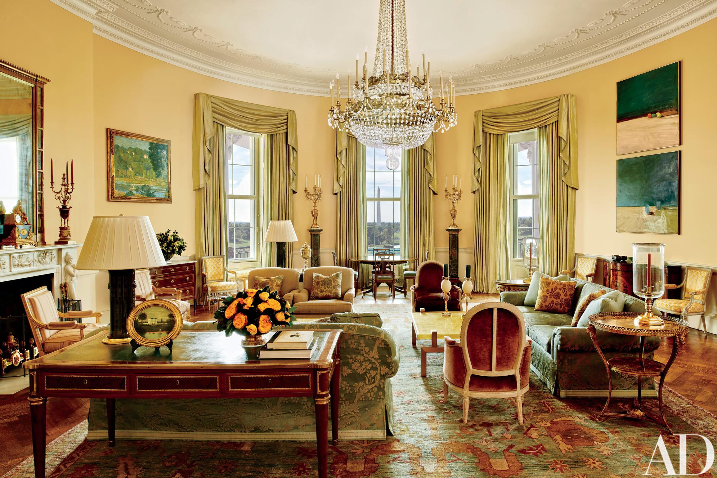 The Yellow Oval Room in the White House in Washington. Designer Michael S. Smith specified a Donald Kaufman paint for the Yellow Oval Room. Artworks by Paul Cézanne and Daniel Garber flank the mantel. Smith mellowed the Yellow Oval Room with smoky browns, greens, golds, and blues. The 1978 Camp David peace accords were signed at the antique Denis-Louis Ancellet desk, front left.