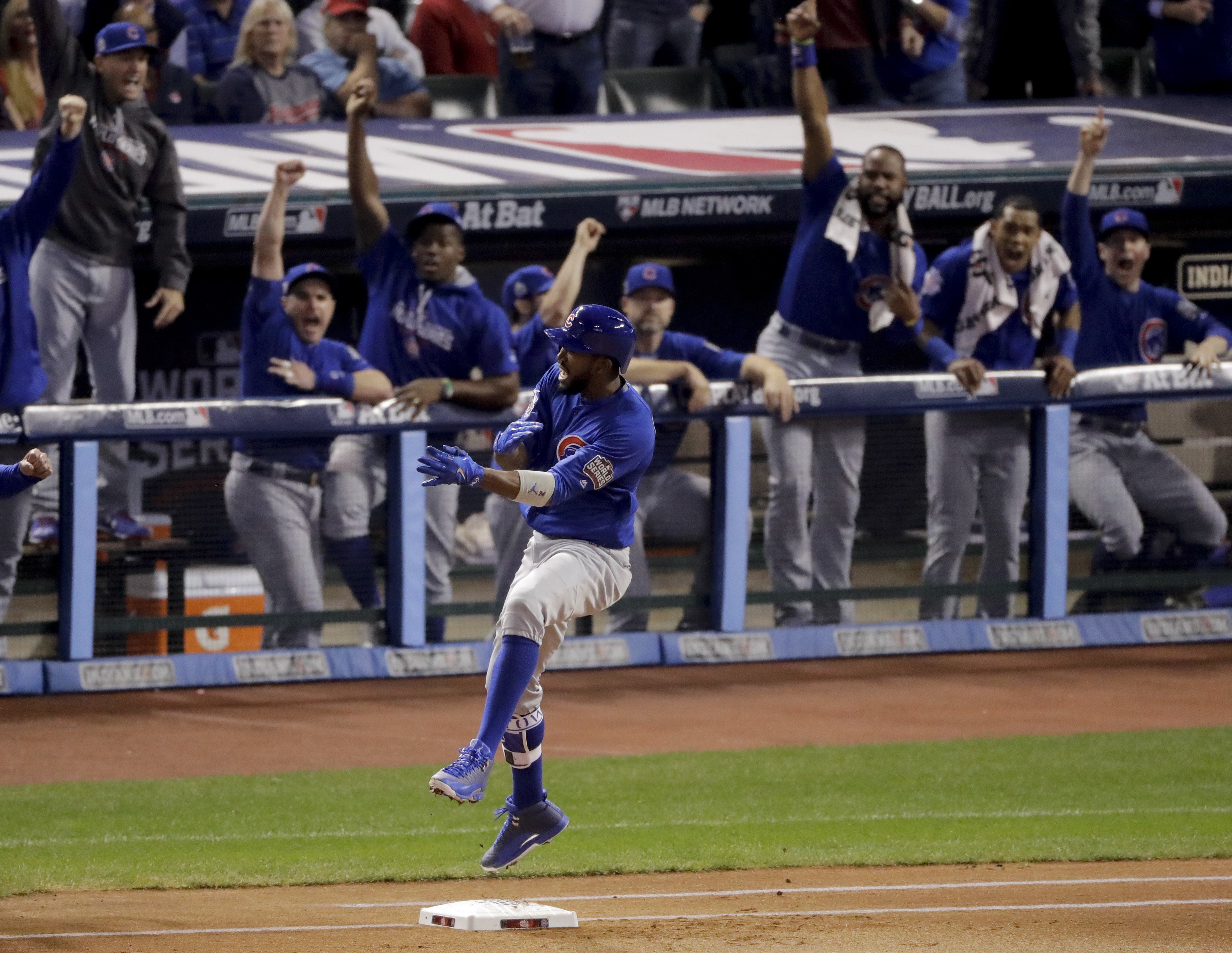 Chicago Cubs' Dexter Fowler celebrates after a leadoff home run against the Cleveland Indians during the first inning of Game 7 of the Major League Baseball World Series Wednesday, Nov. 2, 2016, in Cleveland. (Charlie Riedel—AP)