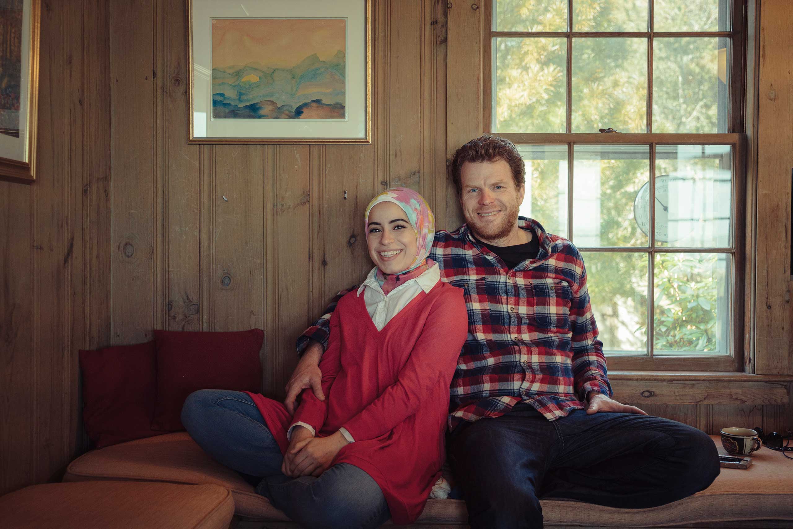 Mona Haydar and Sebastian Robins pose for a photo at their home in Duxbury, Massachusetts before heading to the Cambridge Public Library to set up their  Talk to a Muslim  booth. March 6, 2016.