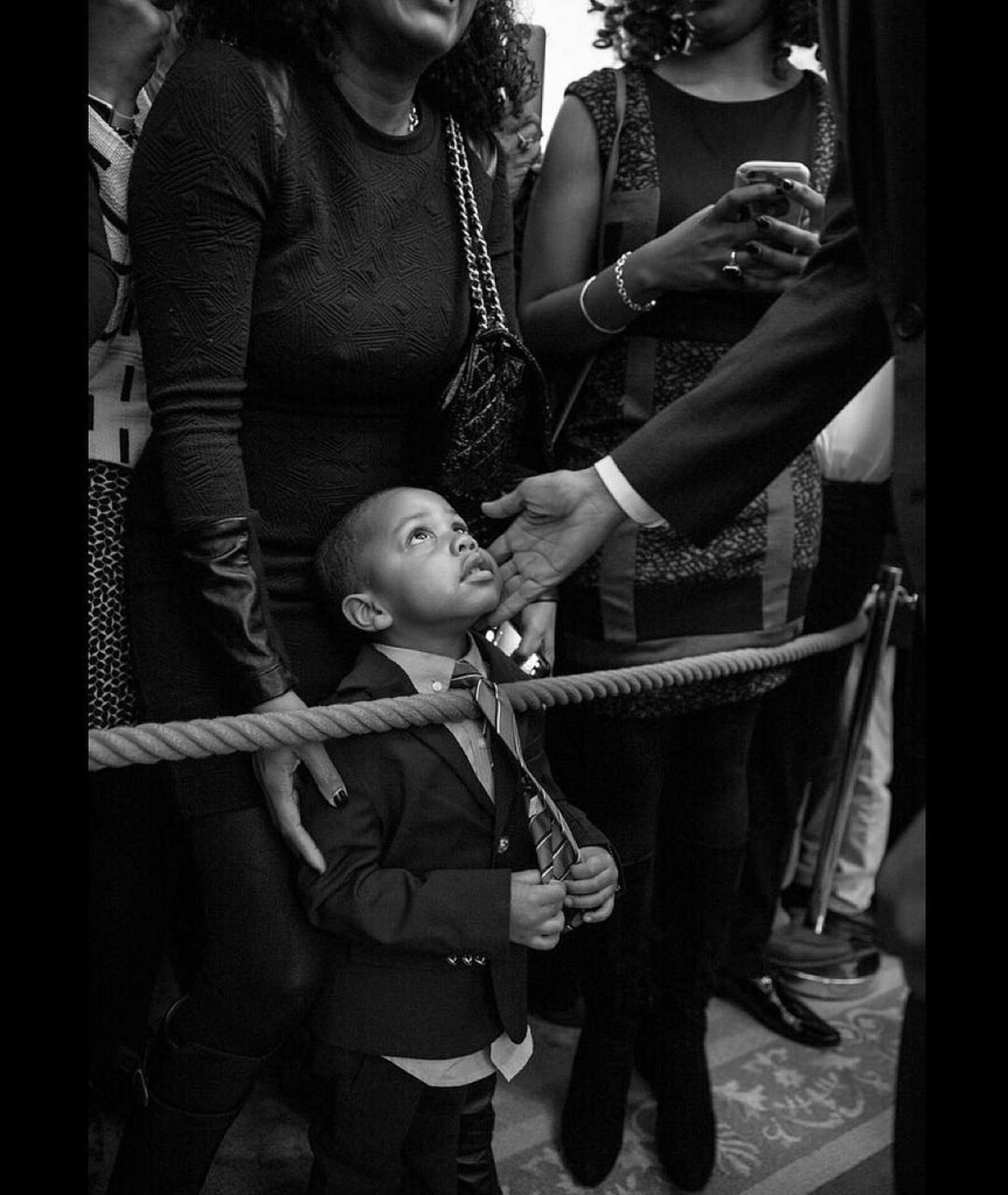 In this official White House photograph, President Barack Obama greets a young guest during a reception celebrating african american history month in the east room of the white house, on Feb. 18, 2016.