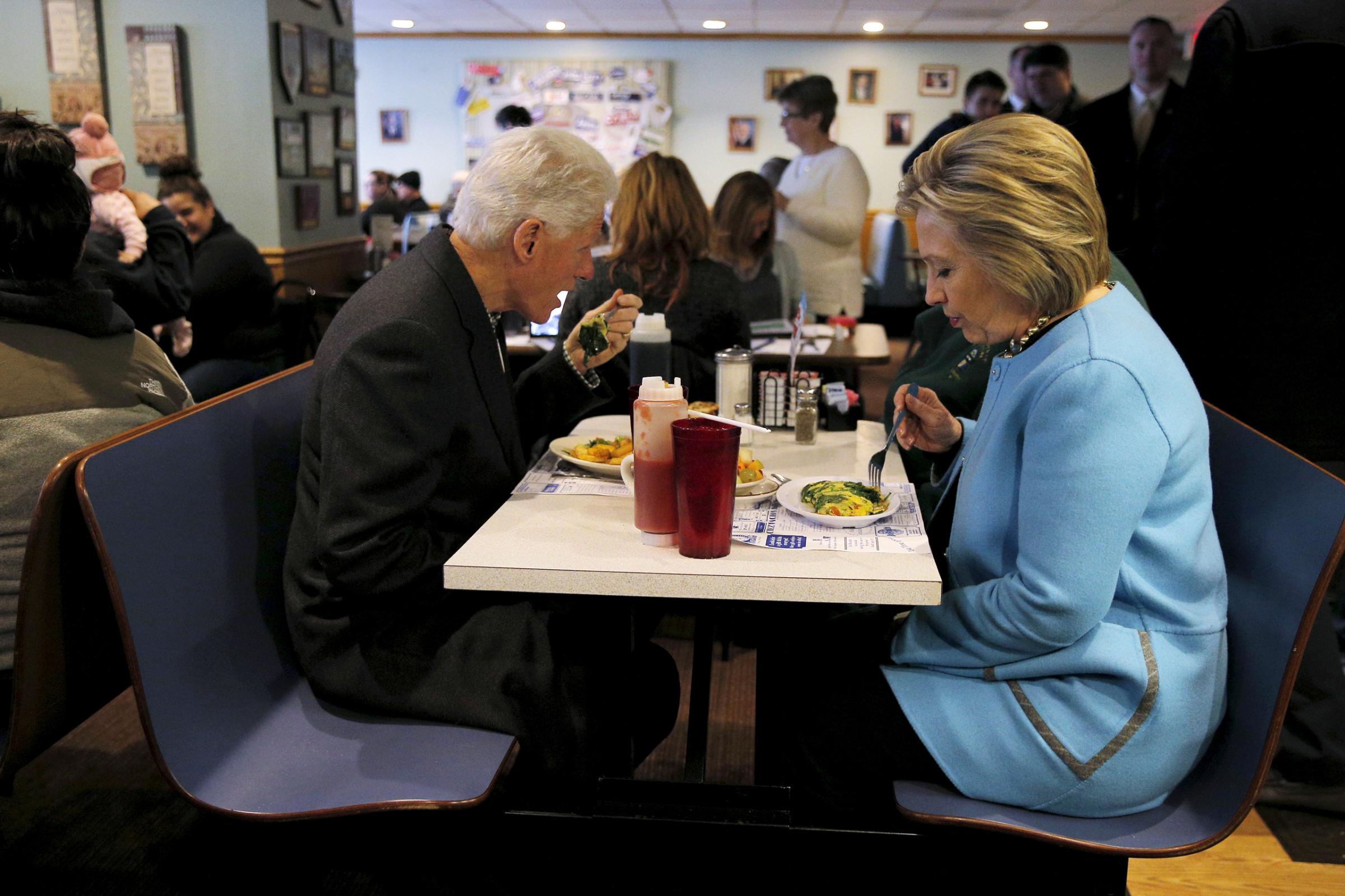 U.S. Democratic presidential candidate Hillary Clinton and her husband, former U.S. President Bill Clinton eat breakfast at the Chez Vachon restaurant in Manchester
