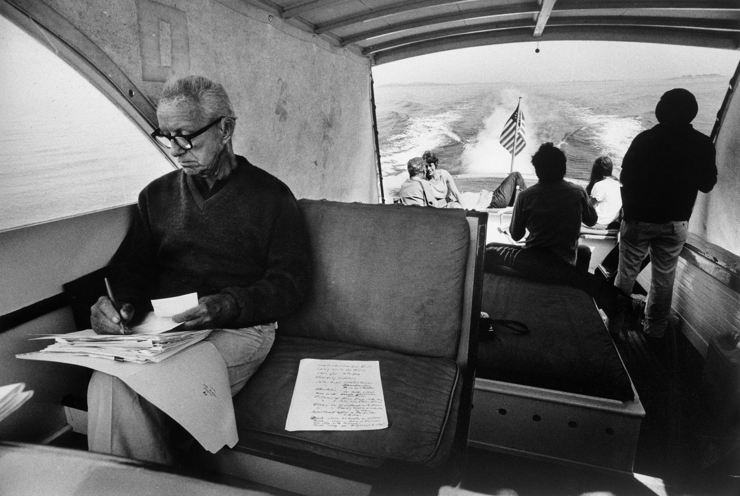 Buckminster Fuller, champion of geodesic domes, ferries houseguests to Bear Island, which his grandmother bought in 1904. It remains his family’s summer seat. Penobscot Bay, Maine, 1970.