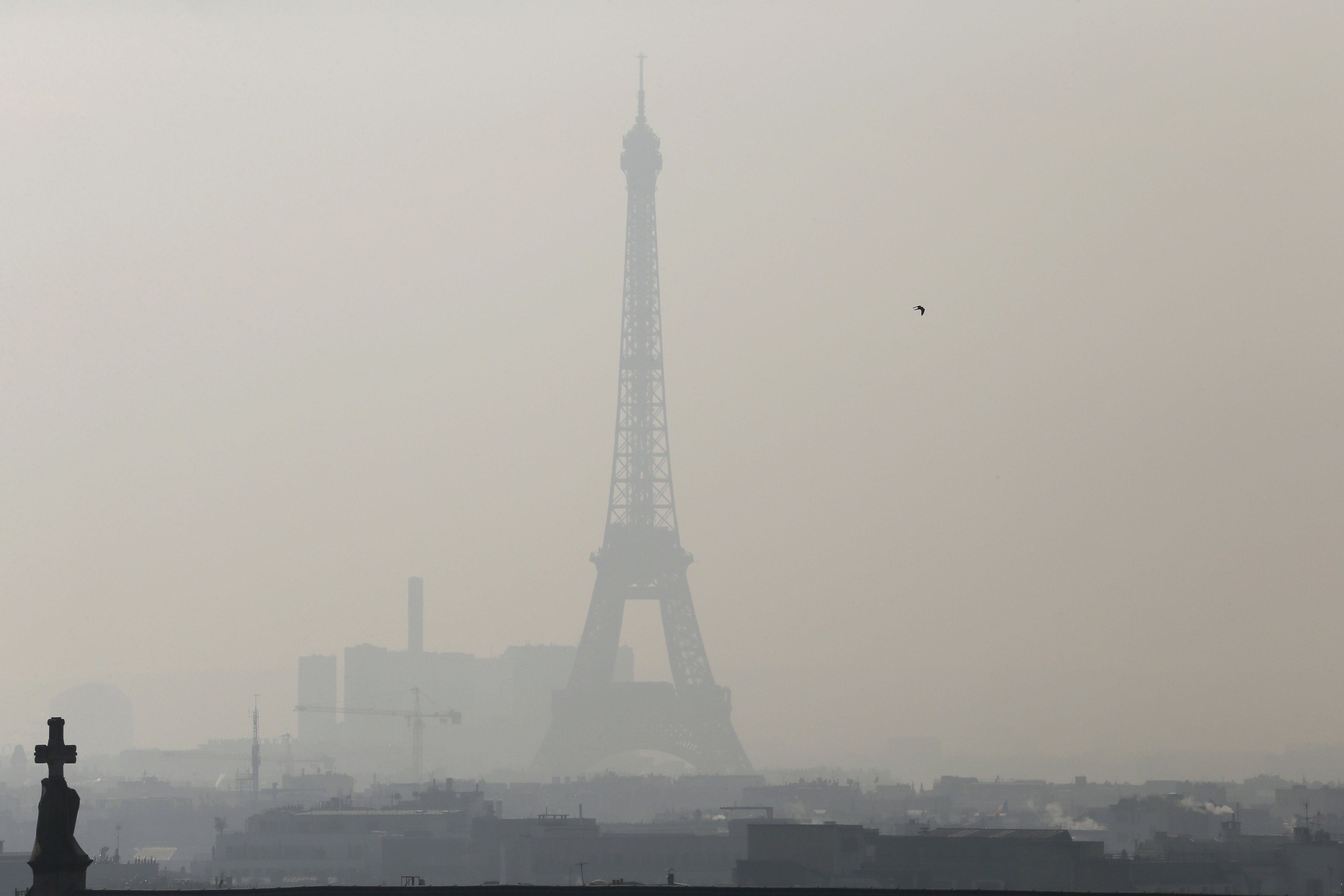 The Eiffel Tower through thick smog on February 12, 2015 (Patrick Kovarik—AFP/Getty Images)
