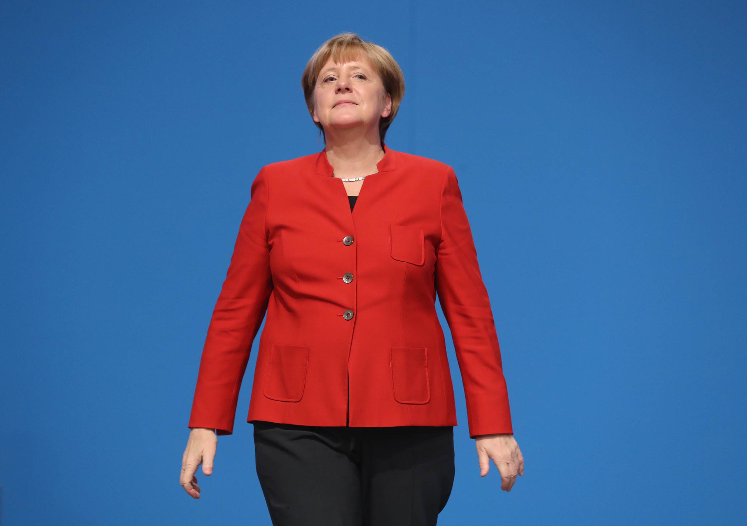 German Chancellor and Chairwoman of the German Christian Democrats Angela Merkel prepares to wave to applauding delegates after she gave her central speech at the 29th federal congress of the CDU in Essen, Germany, on Dec. 6, 2016. (Sean Gallup—Getty Images)