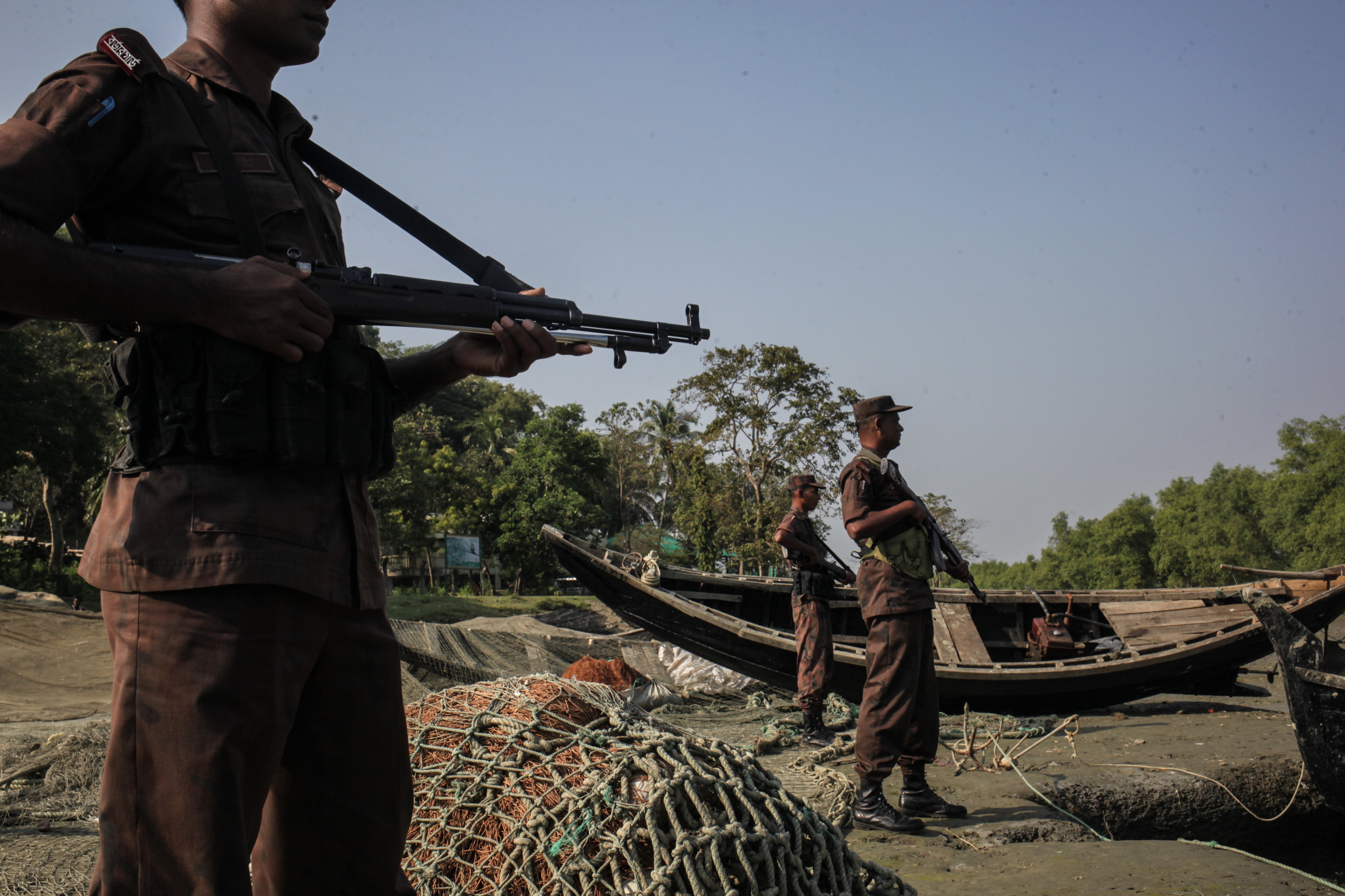 A patrol of Bangladeshi Border Guards attempts to prevent Rohingya refugees from crossing into Bangladesh from Burma, on the banks of the Naf River, near Cox's Bazar, Bangladesh, on Nov. 22, 2016 (Anik Rahman/NurPhoto/Sipa USA)