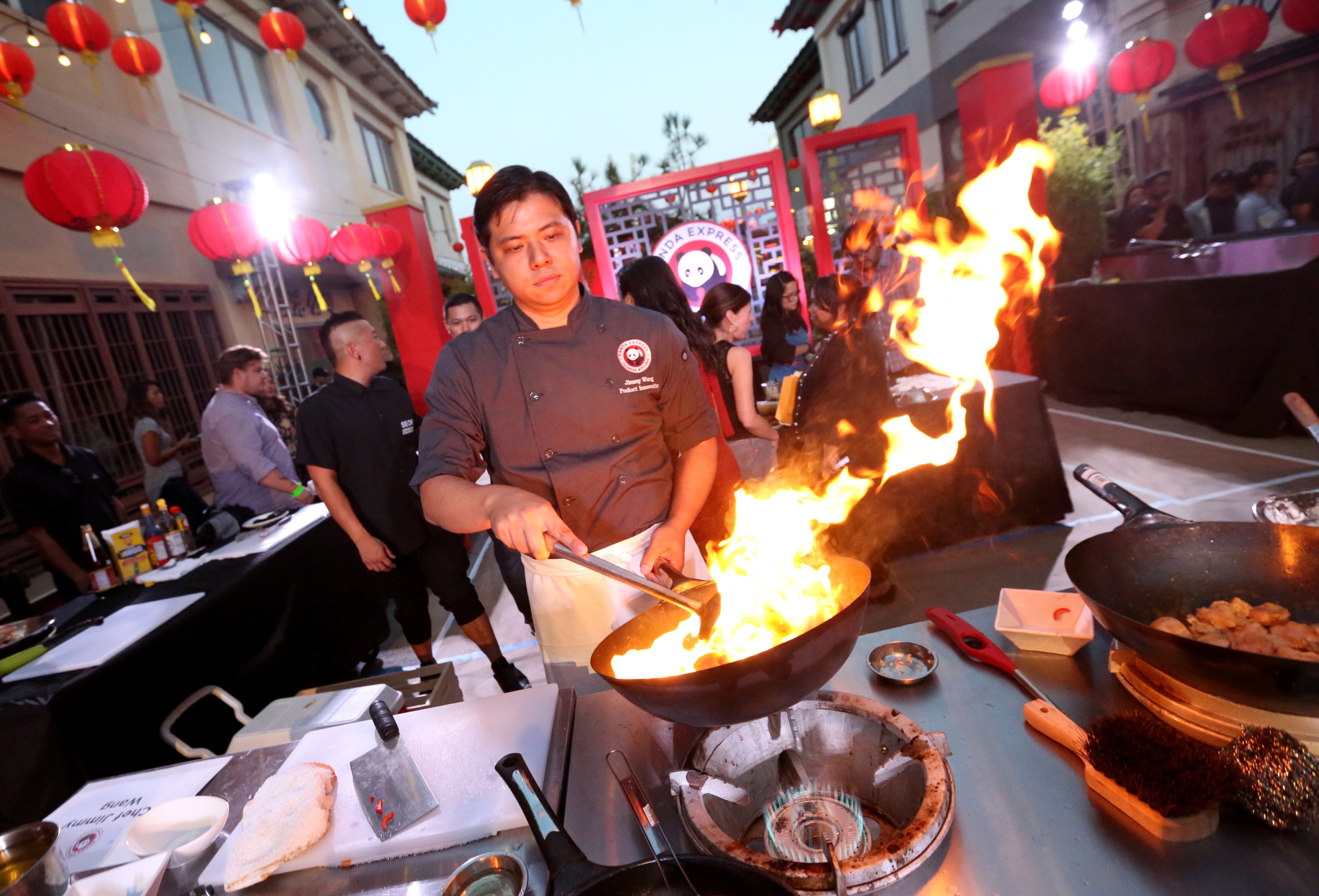Chef Jimmy Wang prepares Panda Express' General Tso's chicken at Chinatown Summer Nights on Saturday, Aug. 20, 2016, in Los Angeles (Casey Rodgers—Invision for Panda Restaurant Group)
