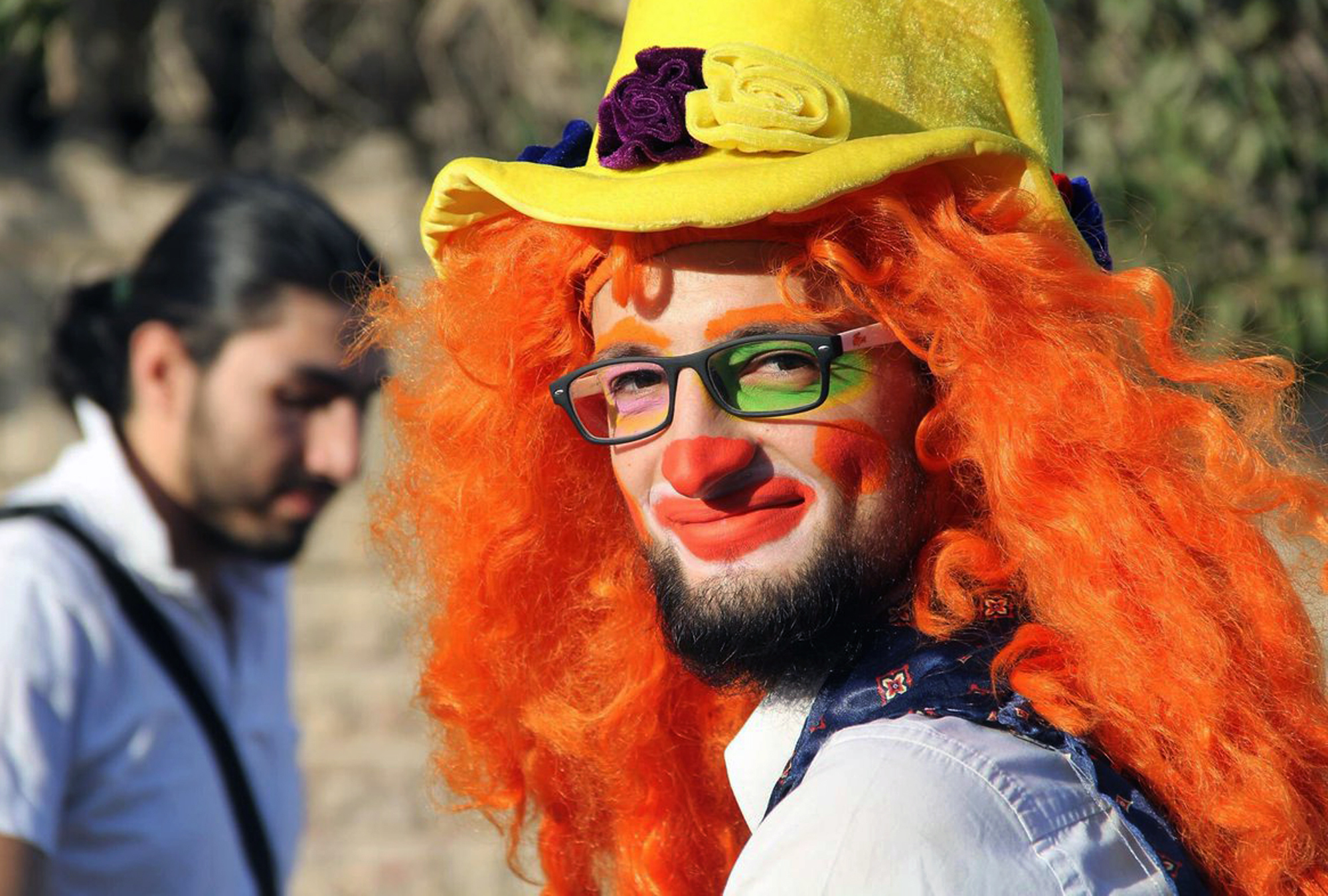 This undated photo courtesy of Ahmad al-Khatib, a media activist in Aleppo, shows Syrian social worker Anas al-Basha, 24, dressed as a clown, while posing for a photograph in Aleppo, Syria. (Uncredited—AP)