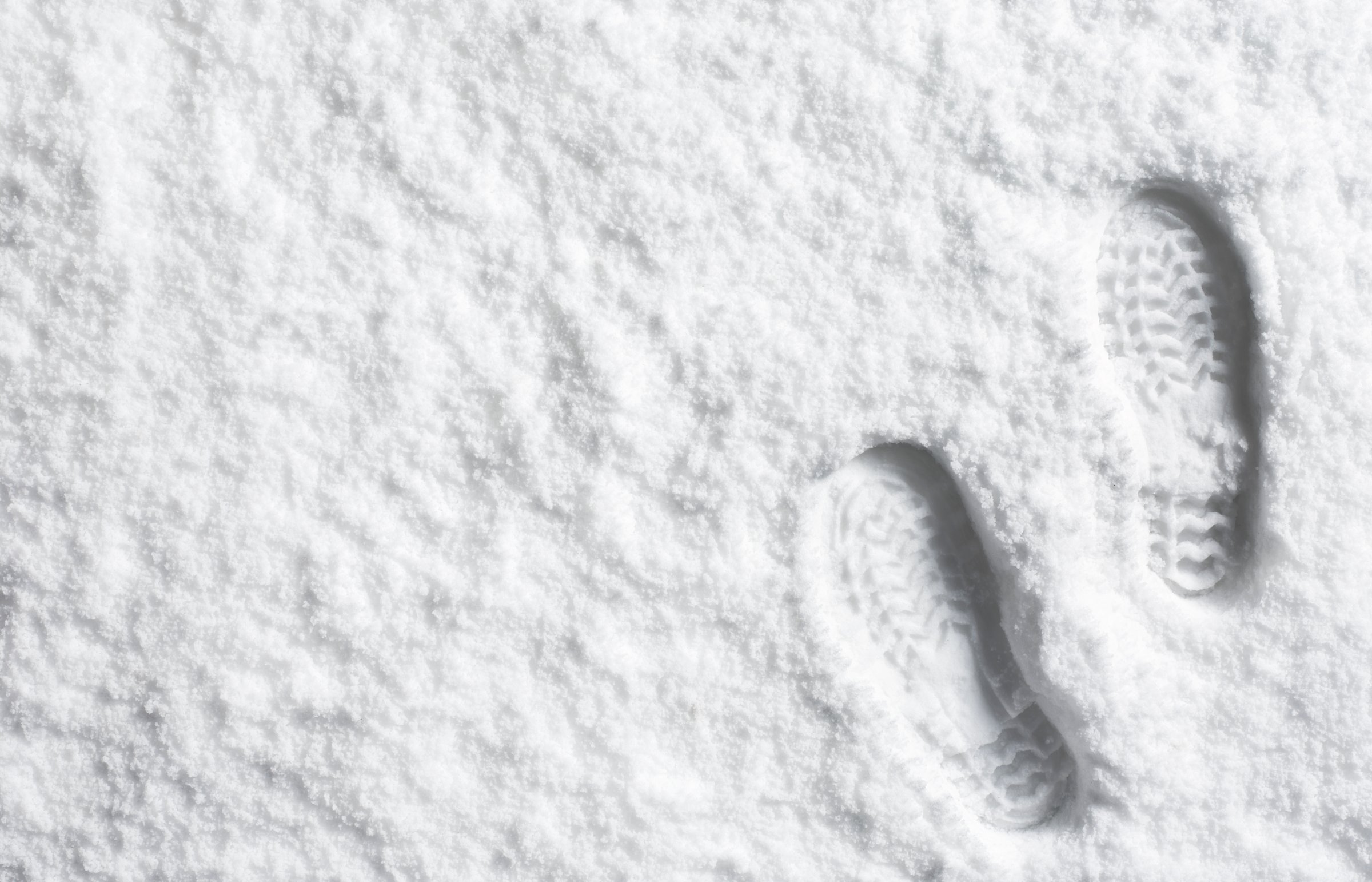 Landscape powder snow scene with foot prints