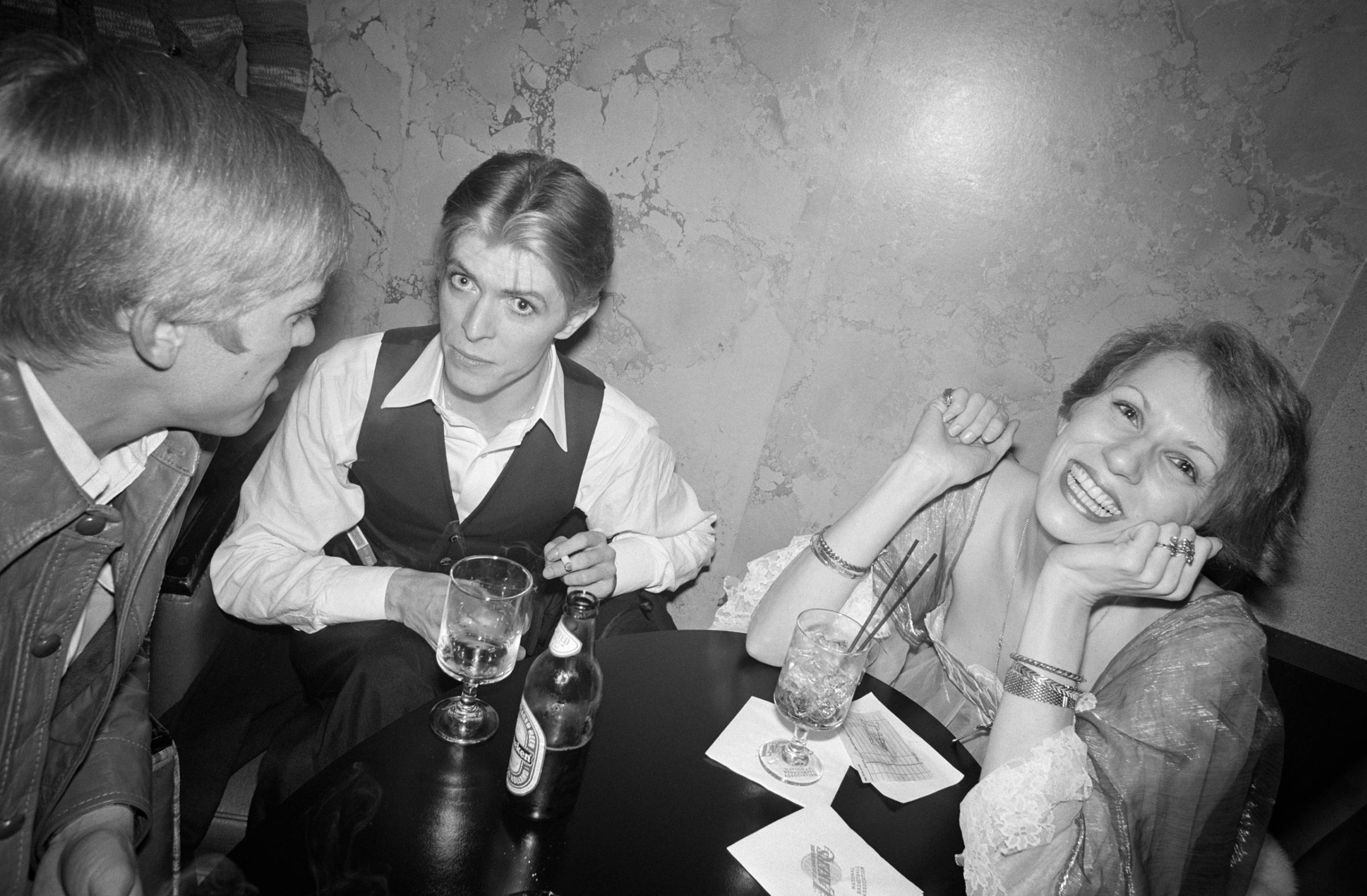 Bowie and his wife, Angela, with President Gerald Ford’s son, Steven, at a party in Los Angeles celebrating “Fame” being certified a gold record.