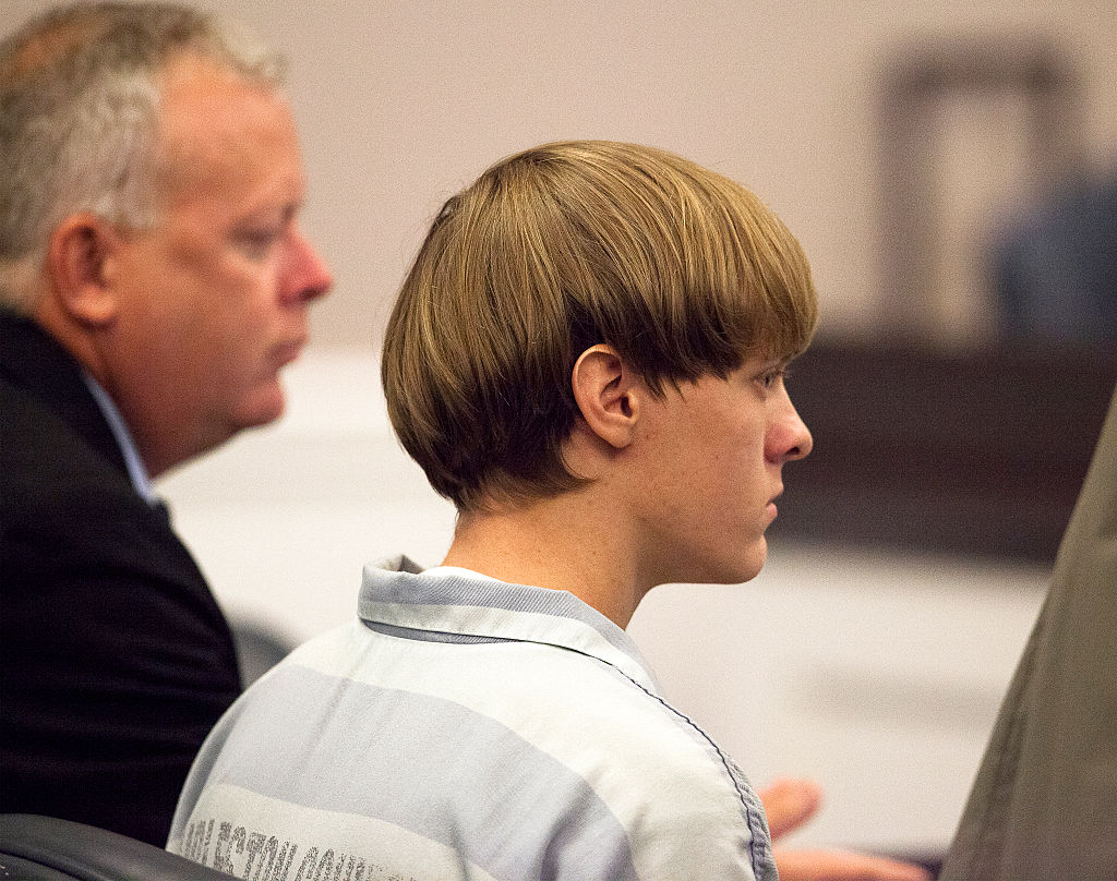 Dylann Roof, 21, listens to proceeding with assistant defense attorney William Maguire during a hearing at the Judicial Center in Charleston, S.C., on July 16, 2015. (Randall Hill—Pool/Getty Images)