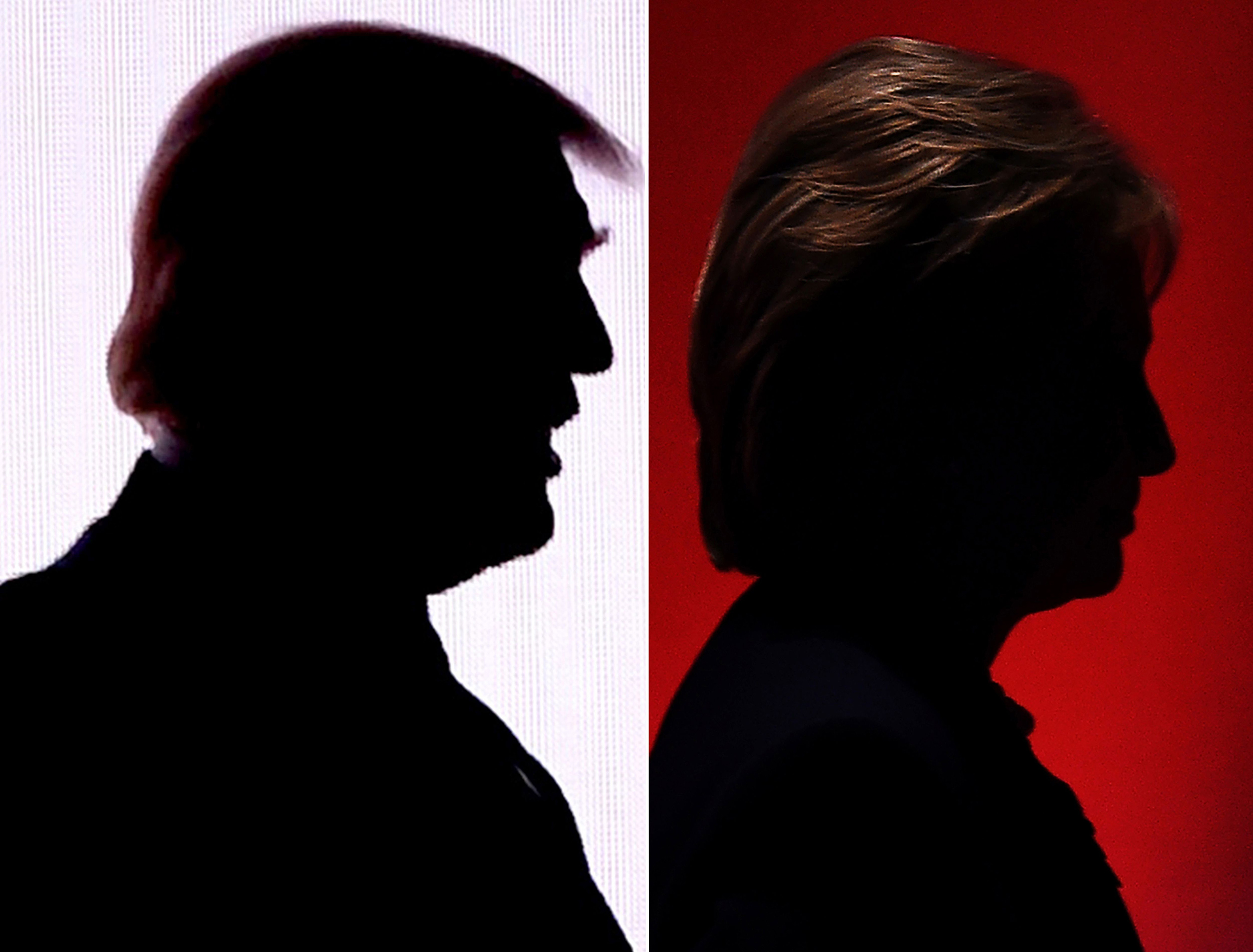 This combination photo shows the silhouettes of Republican presidential nominee Donald Trump on July 18, 2016 and Democratic presidential nominee Hillary Clinton on February 4, 2016. (DESK/AFP/Getty Images)
