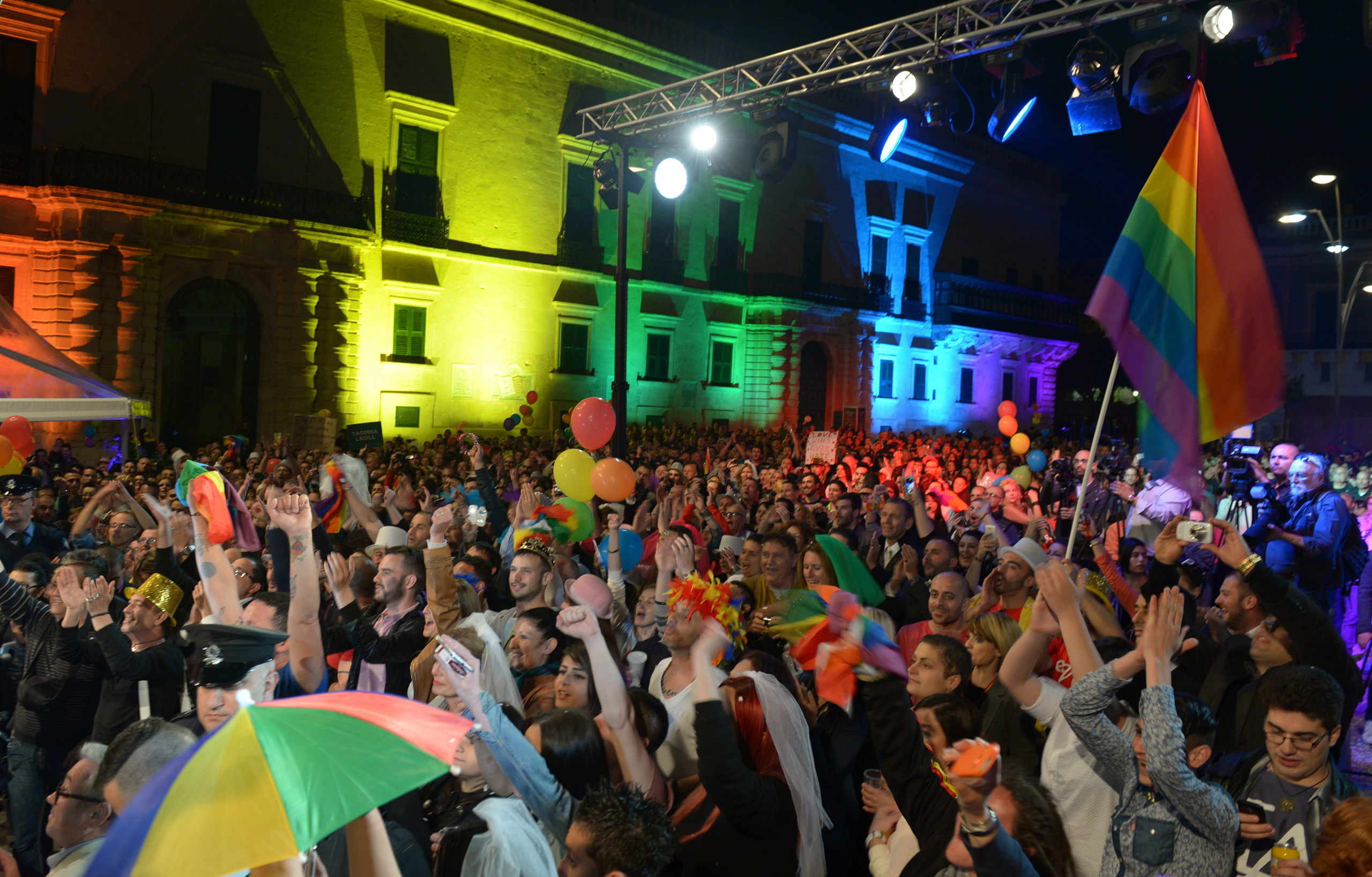 People celebrate in Saint George's Square after the Maltese parliament approved a civil unions bill in Valletta on April 14, 2014. (Matthew Mirabelli—AFP/Getty Images)