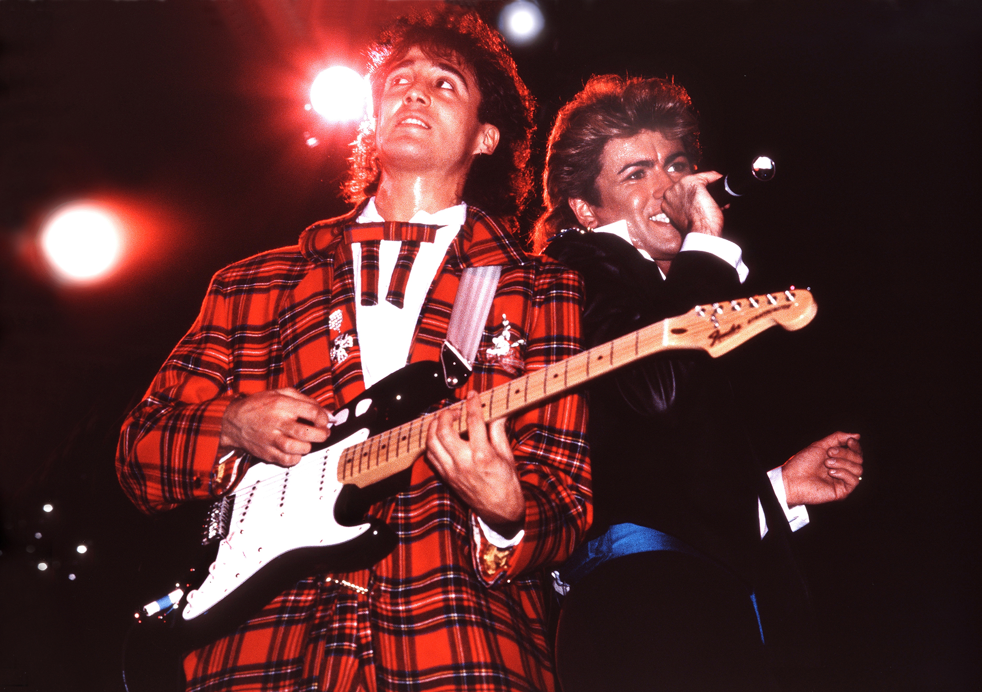 Andrew Ridgeley and George Michael of Wham! perform in London in 1984.