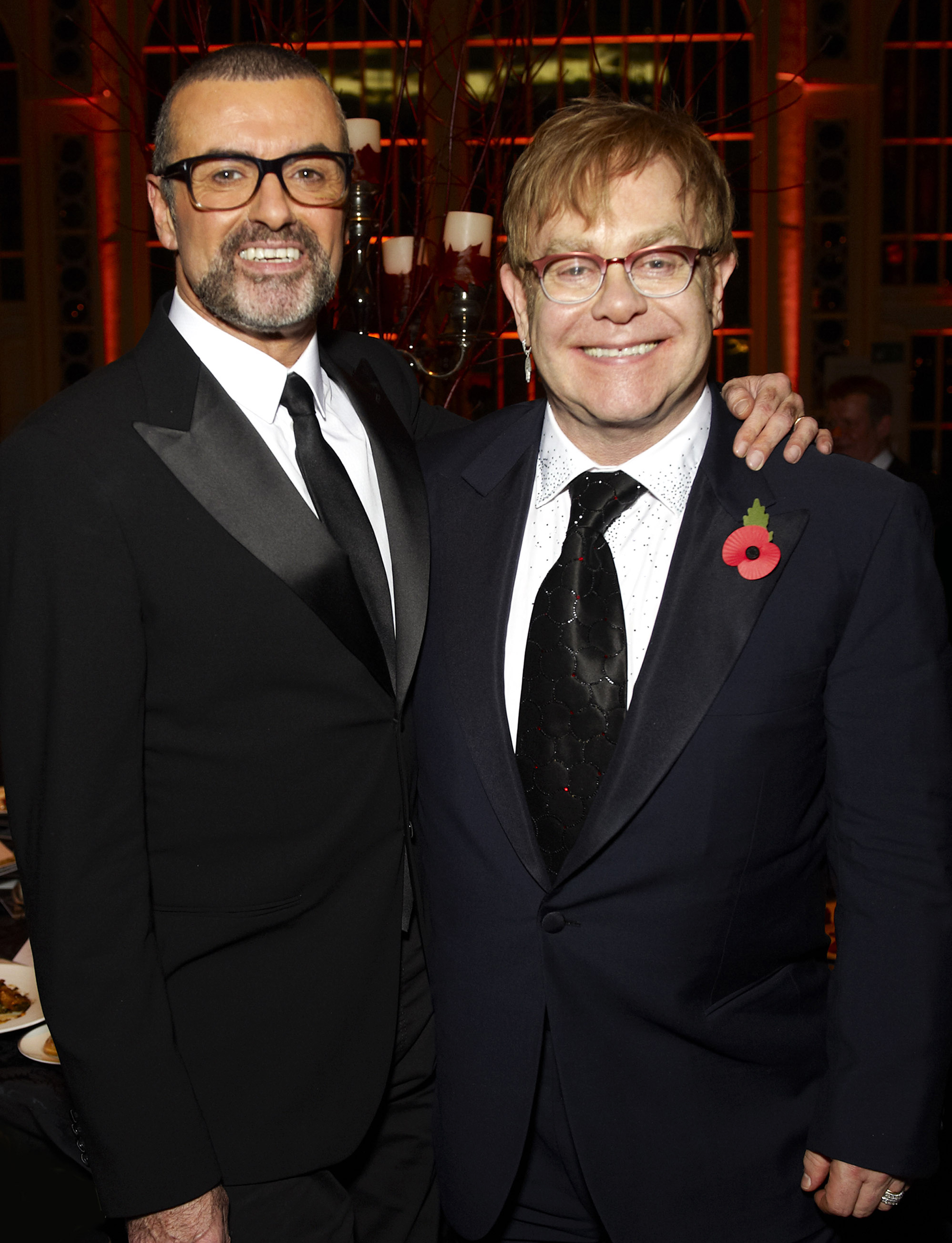 George Michael and Elton John attend a charity performance benefiting the Elton John AIDS Foundation in London, on Nov. 6, 2011.