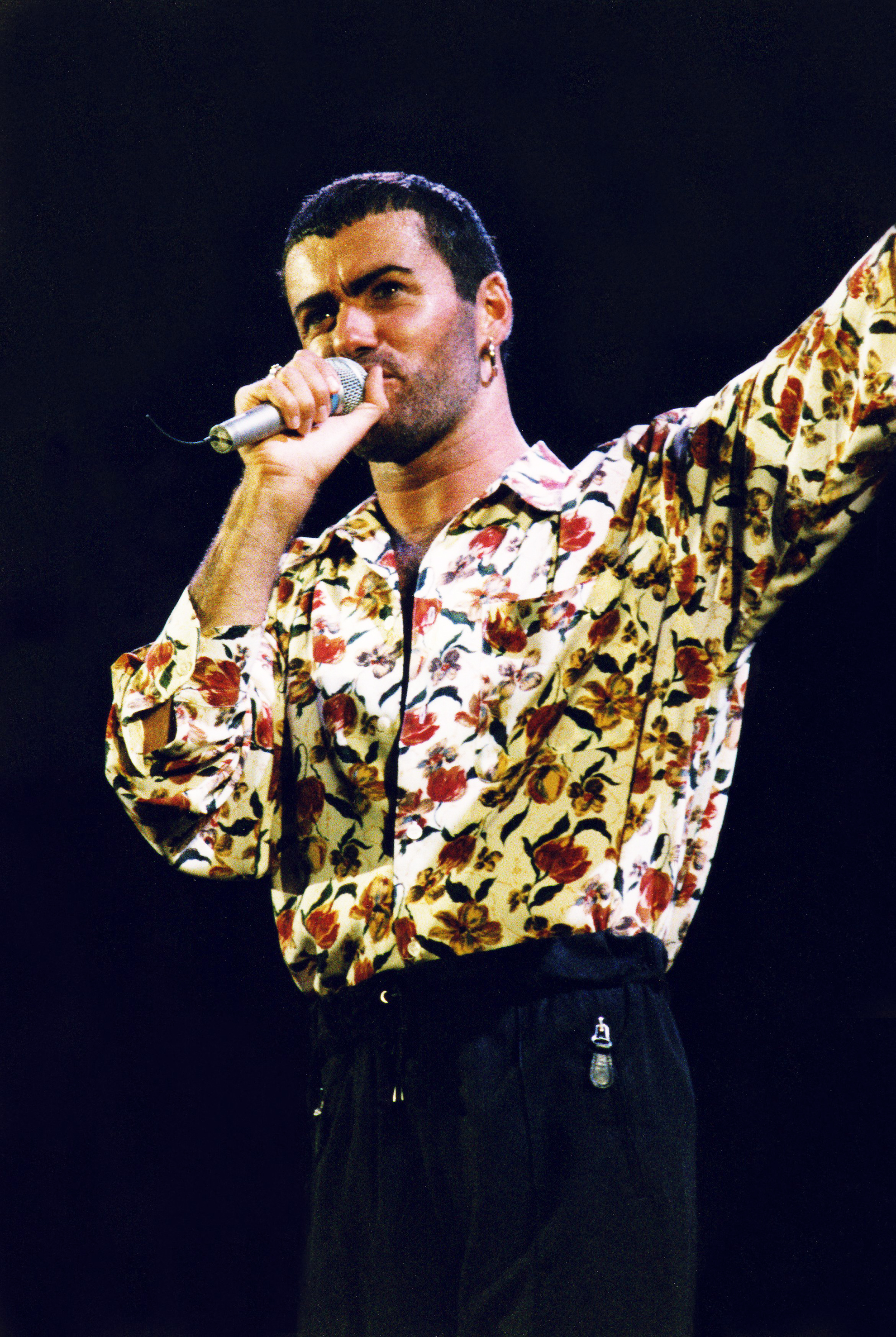 George Michael performs at Wembley Arena in London, on March 22, 1991.