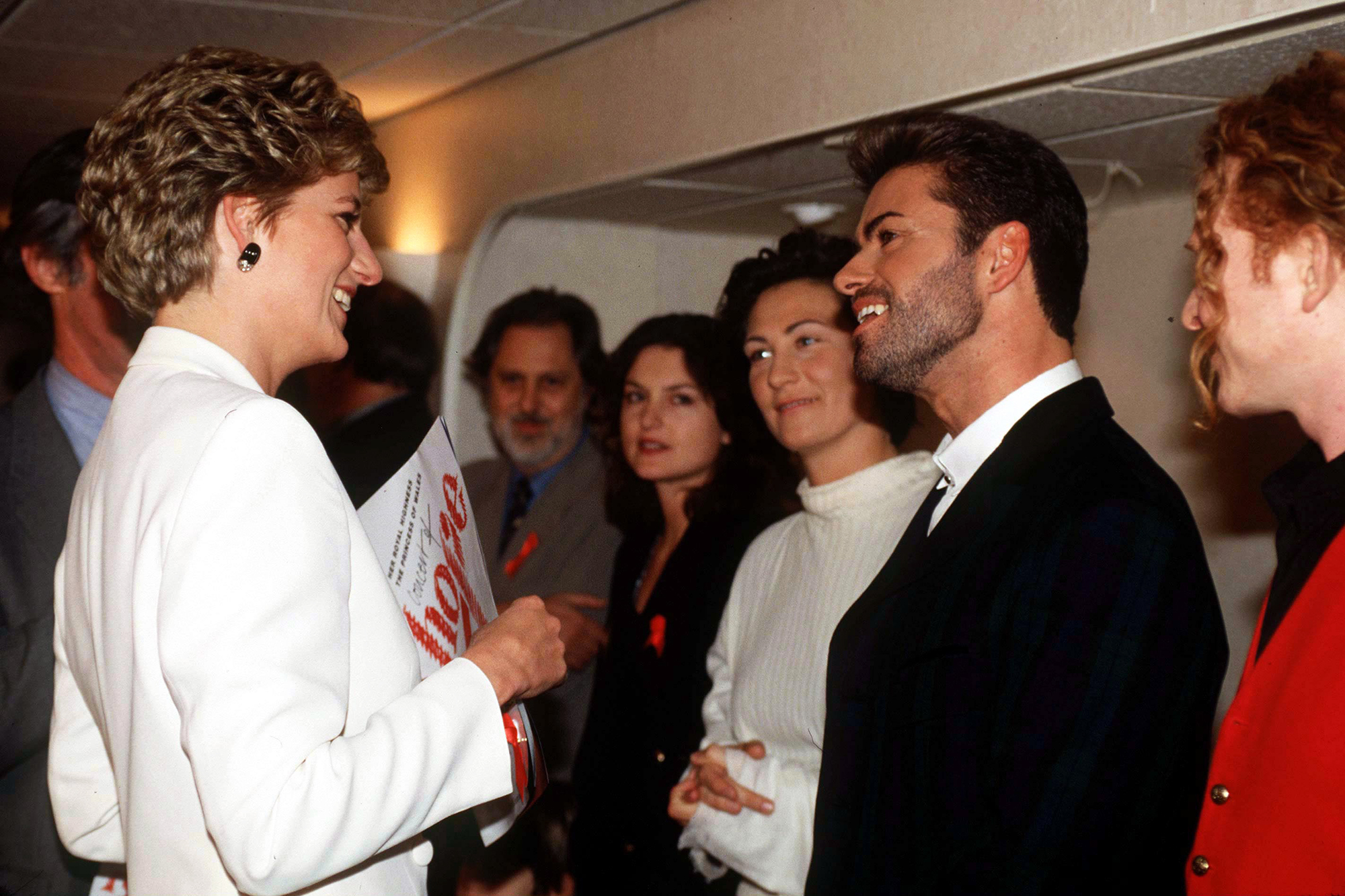 Princess Diana speaks with George Michael at The World Aids Day Annual "Concert of Hope" at Wembley Arena in London on Dec. 1 1993.