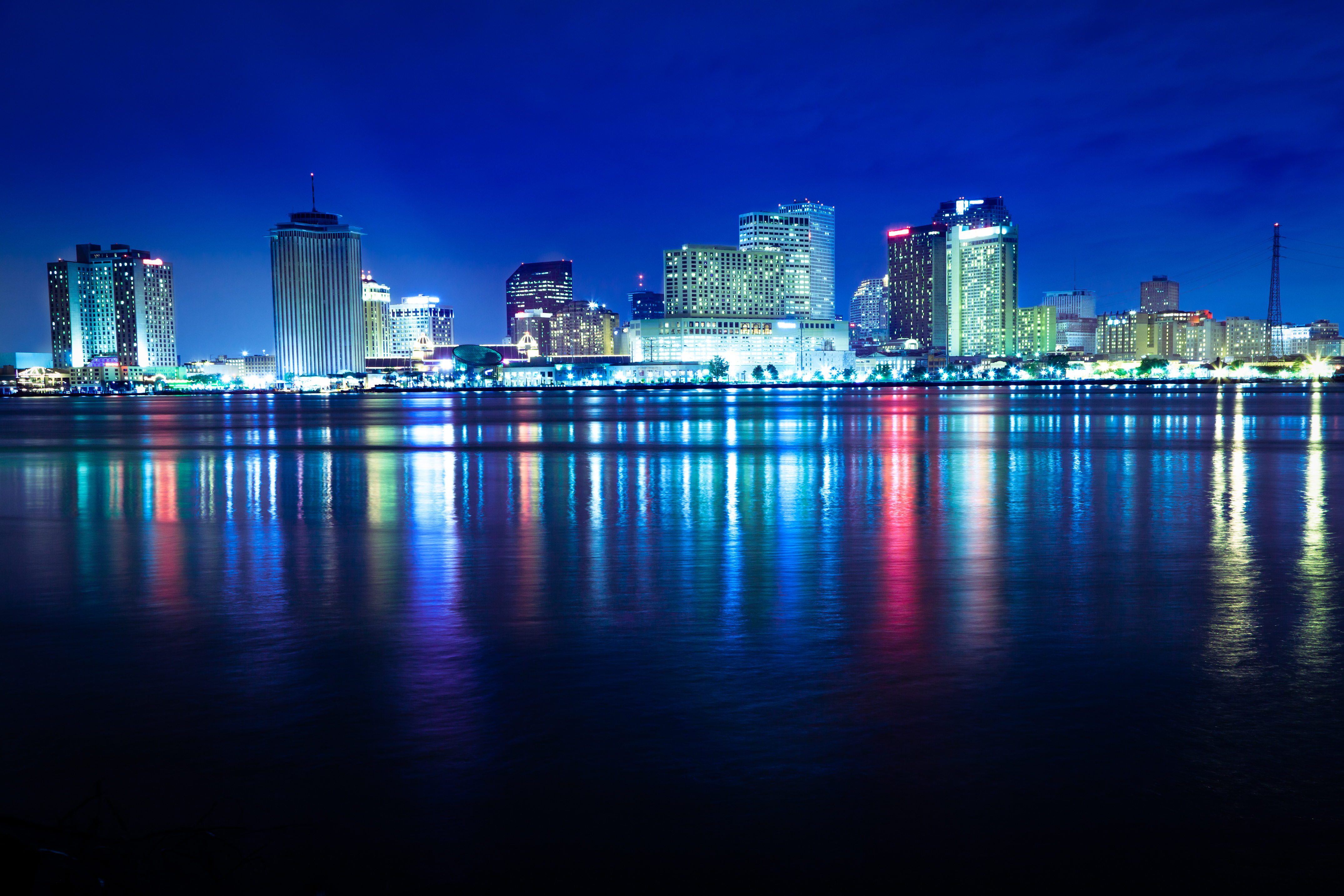 The New Orleans skyline reflects on the Mississippi River. (lightkey&mdash;Getty Images)