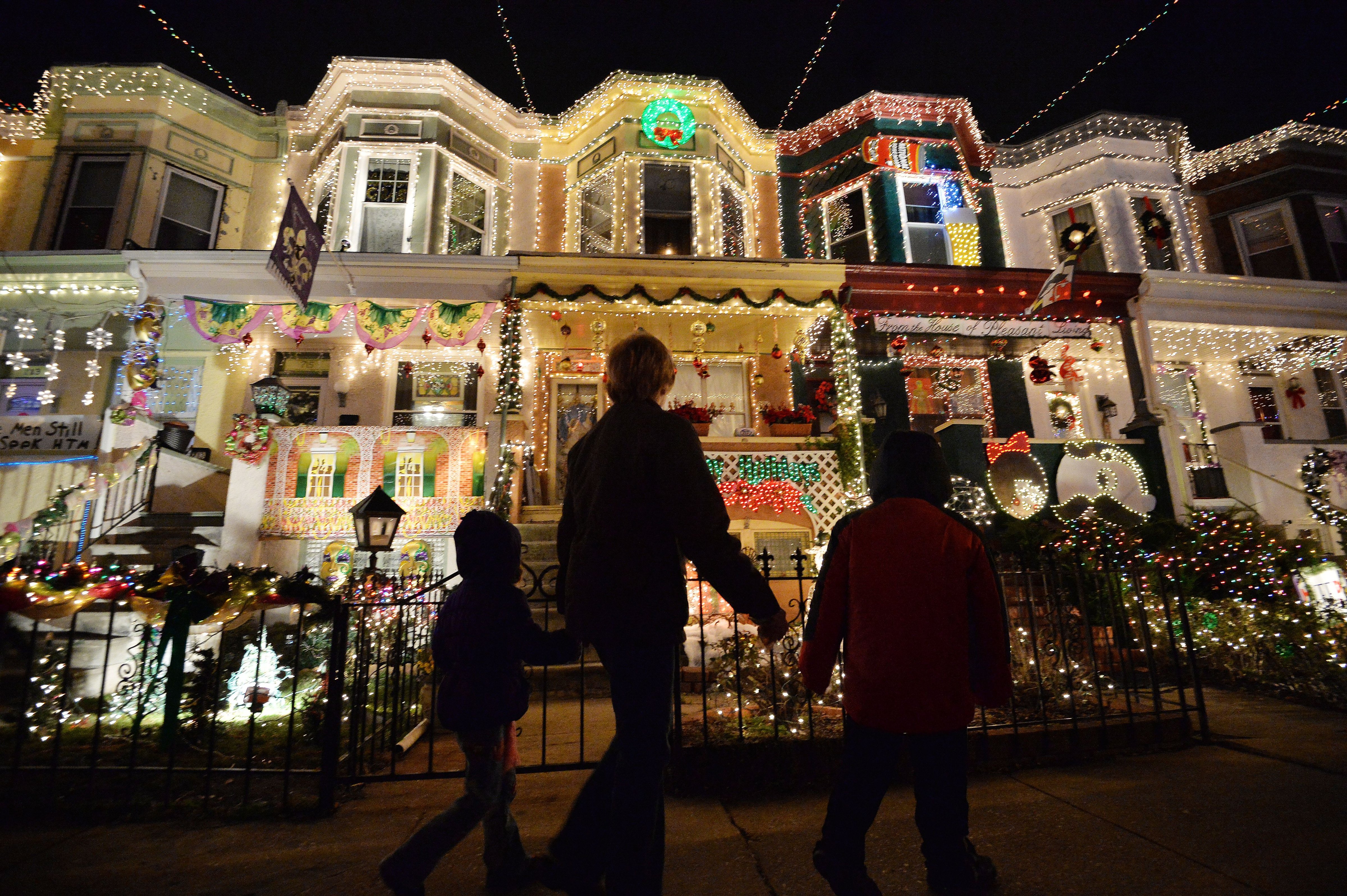 People enjoy the Christmas lights on the 700 block of 34th Street in the Hampden community of Baltimore, Maryland on December 12, 2014. (Mladen Antonov&mdash;AFP/Getty Images)
