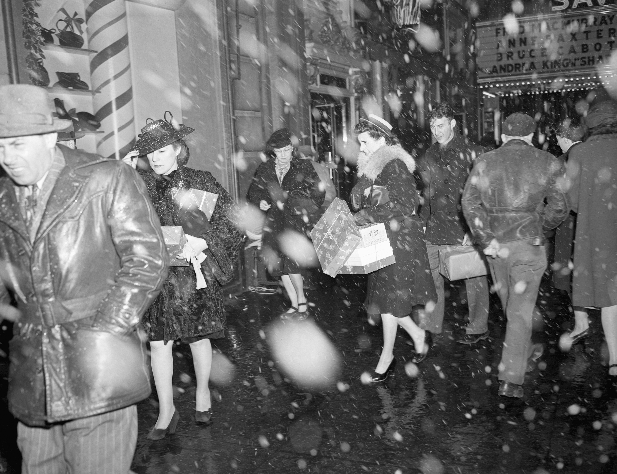 New York City December 20th, 1946. Christmas shoppers on 34th street walk through New York's first real snowfall. Earlier in the day, the weatherman warned of flurries and mentioned the possible white Christmas.