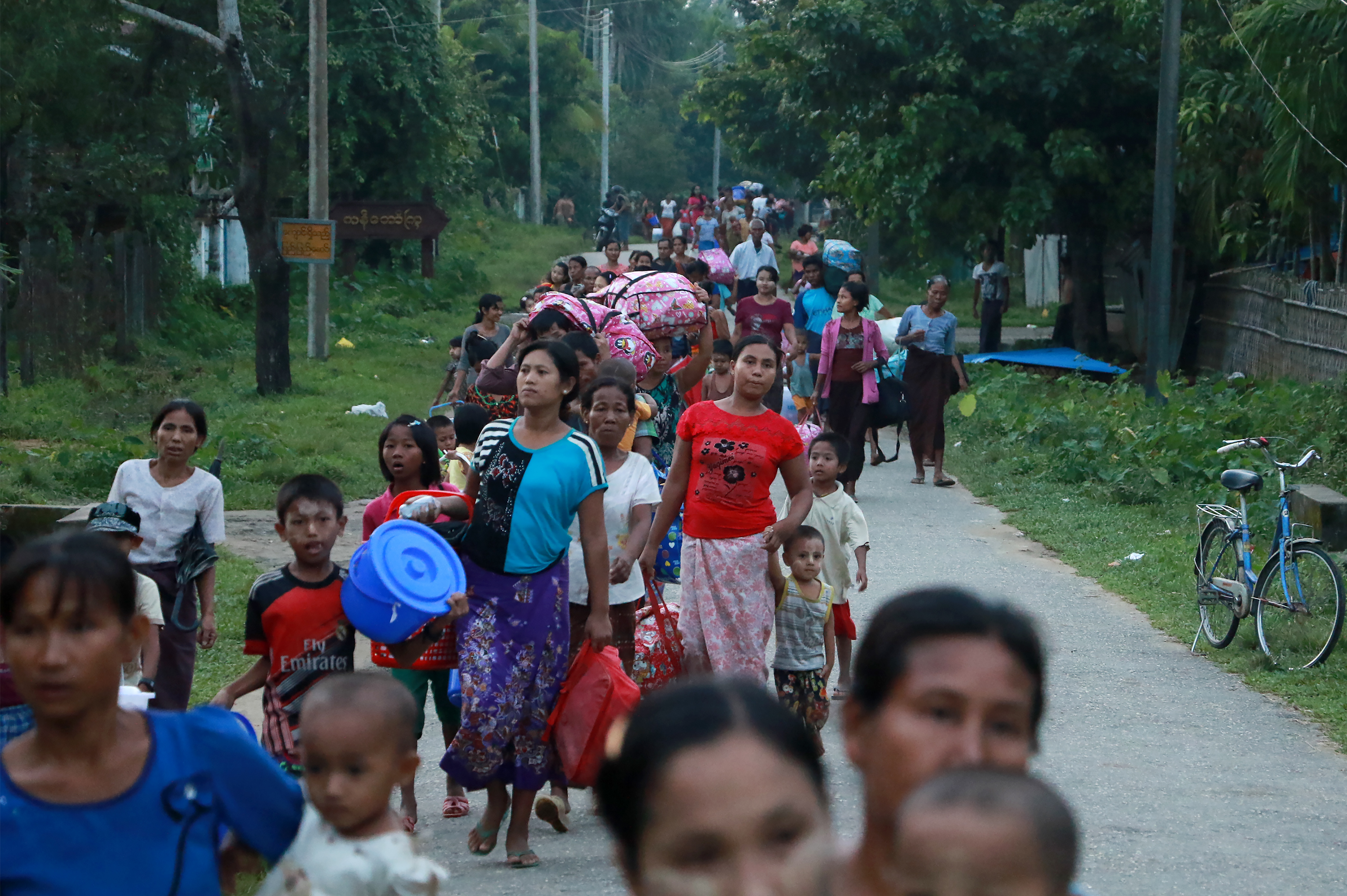 Residents displaced by conflict flee from Maungdaw, in Burma's Rakhine state, on Oct. 13, 2016 (STR—AFP/Getty Images)
