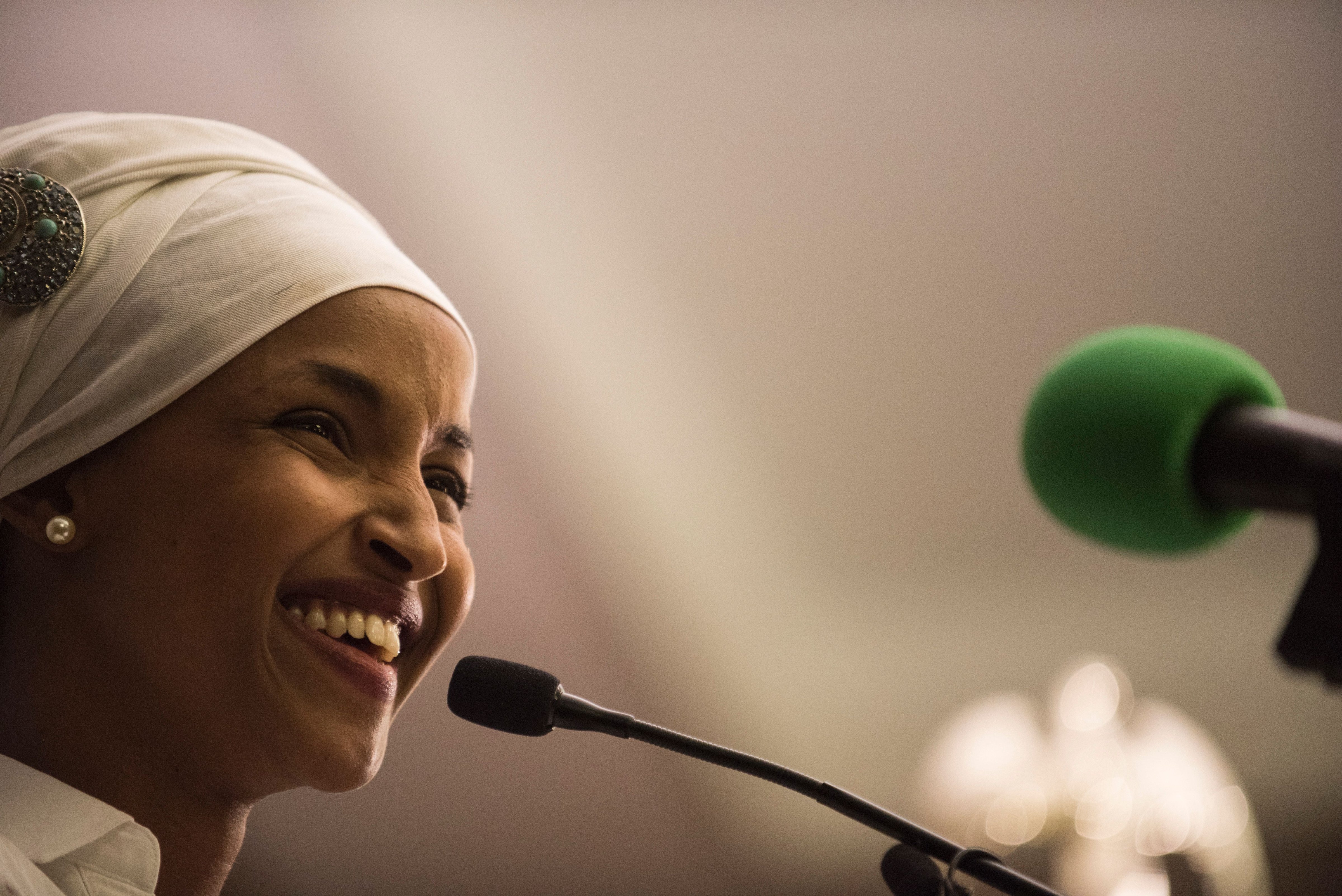 Ilhan Omar, a candidate for State Representative for District 60B in Minnesota, gives an acceptance speech on election night, Nov. 8, 2016 in Minneapolis, Minnesota. 
                      Omar, a refugee from Somalia, is the first Somali-American Muslim woman to hold public office. (STEPHEN MATUREN—AFP/Getty Images)