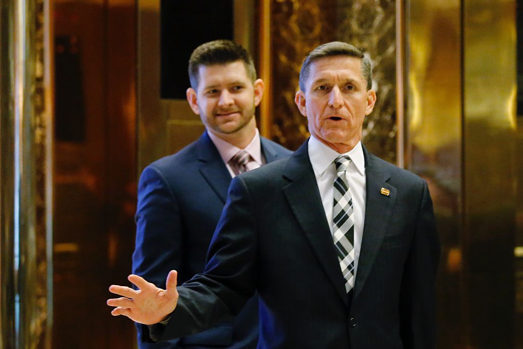 Retired Army three-star general Michael T. Flynn arrives at Trump Tower last month with his son, Michael G. Flynn. (EDUARDO MUNOZ ALVAREZ / AFP / Getty Images)