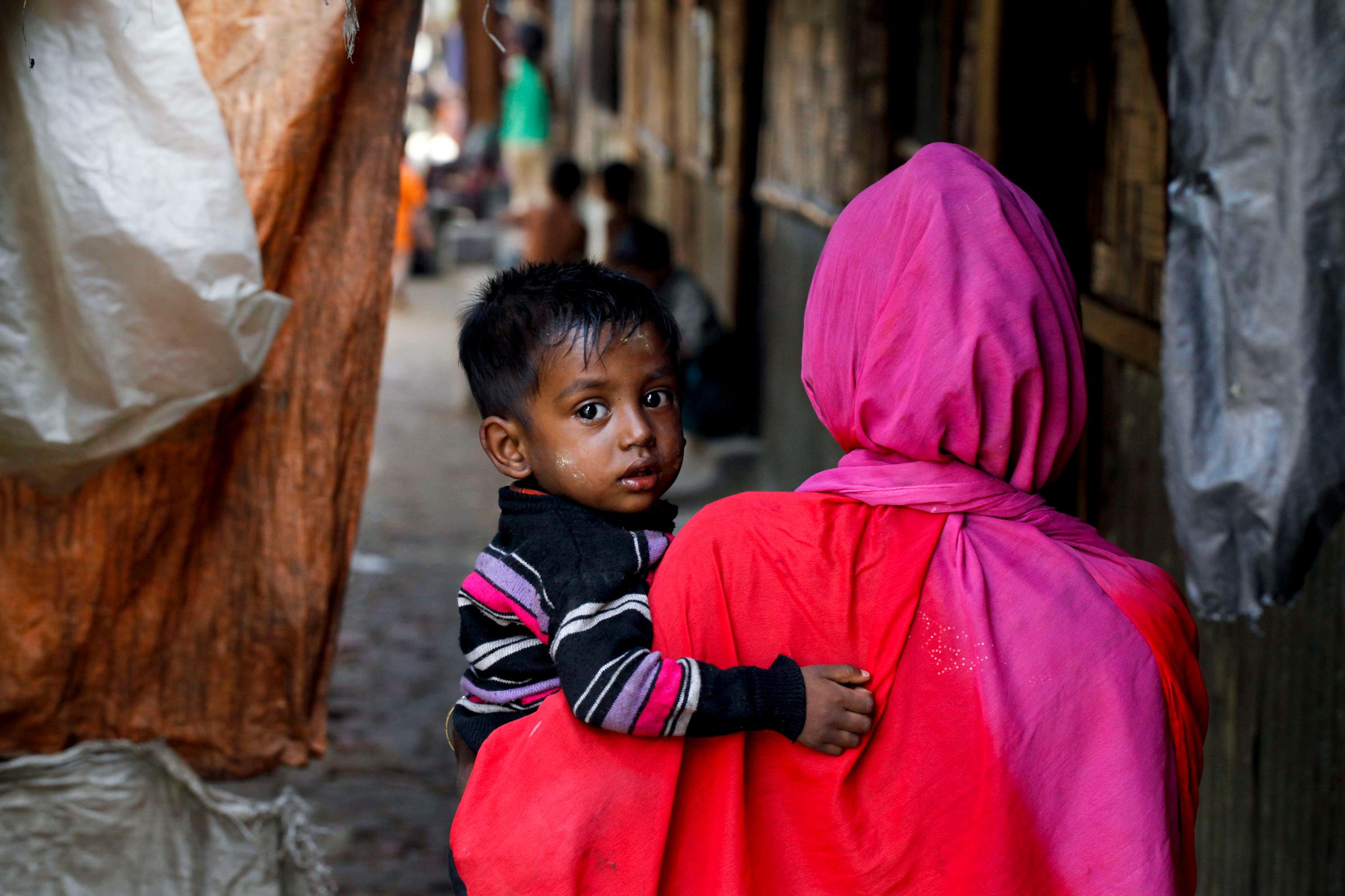 Rohingya refugee woman with her boy in unregistered Rohingya
